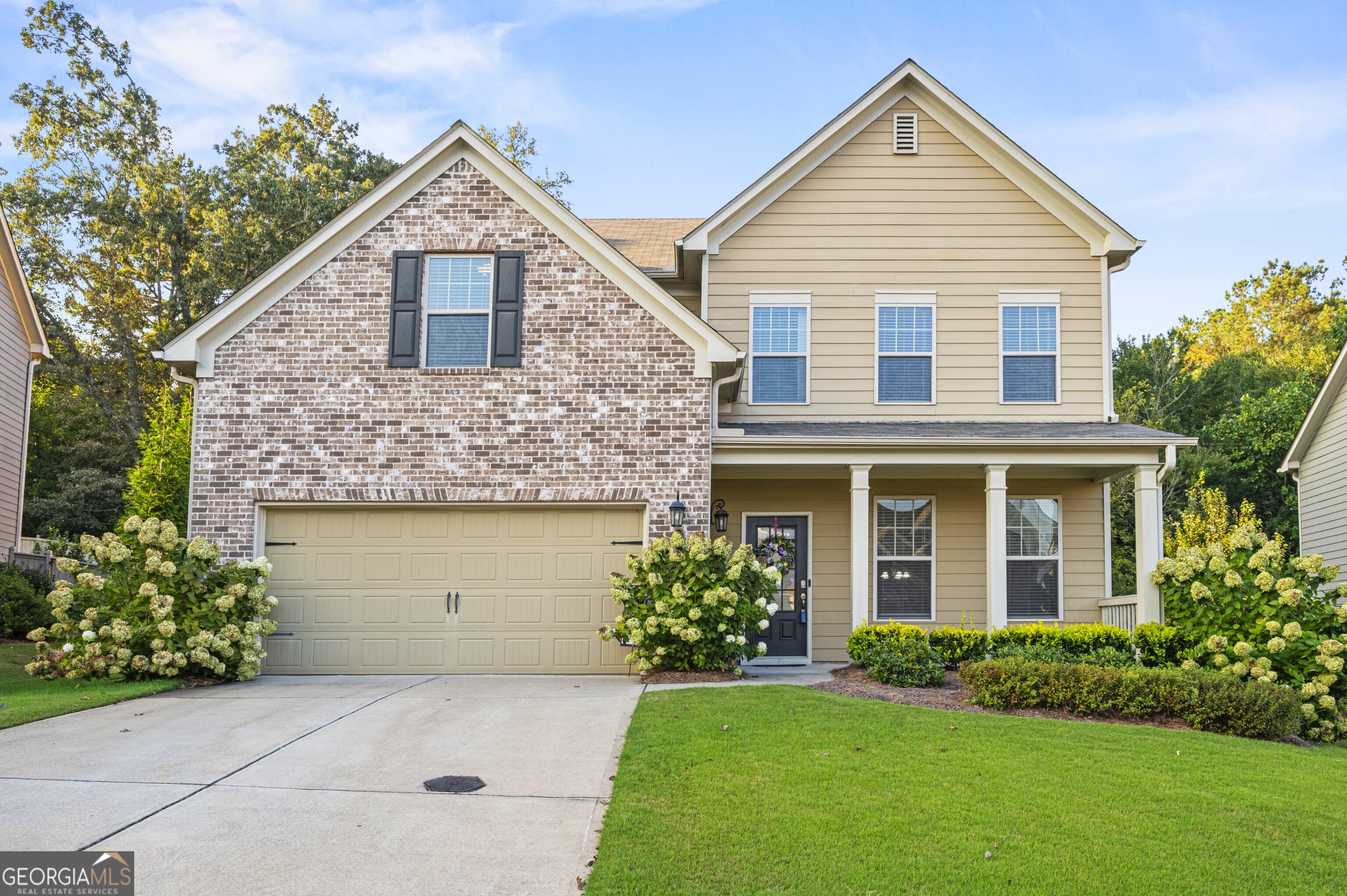 Welcome to a better-than-new Taylor Morrison home in the highly desirable Settlers Lake community. Built in 2019 by one of the nation's most respected homebuilders and meticulously maintained by its original owner, this property showcases Taylor Morrison craftsmanship with thoughtful upgrades that truly make it stand out. From the curb, blooming hydrangeas and established landscaping create exceptional curb appeal. Inside, the open-concept, light-filled floor plan features hardwood floors on the main level and a chef's kitchen with granite countertops, walk-in pantry, and a large island perfect for entertaining. A private home office/flex space offers versatility for today's lifestyle. Upstairs, discover spacious secondary bedrooms with generous closets, a large laundry room, and a serene primary suite retreat with walk-in closet, soaking tub, and separate shower. One secondary bedroom even includes a private ensuite bath-ideal for guests or multigenerational living. Enjoy outdoor living in the fenced backyard nestled in nature, or take advantage of resort-style community amenities just steps away: pool, playground, tennis and basketball courts, plus a neighborhood lake with swim dock. With easy access to GA-400-perfect for commuters-this home is close to top-rated North Forsyth schools, shopping, dining, recreation, and Lake Lanier just minutes away. Move-in ready and already upgraded, this Taylor Morrison home combines quality, convenience, and lifestyle in one perfect package.