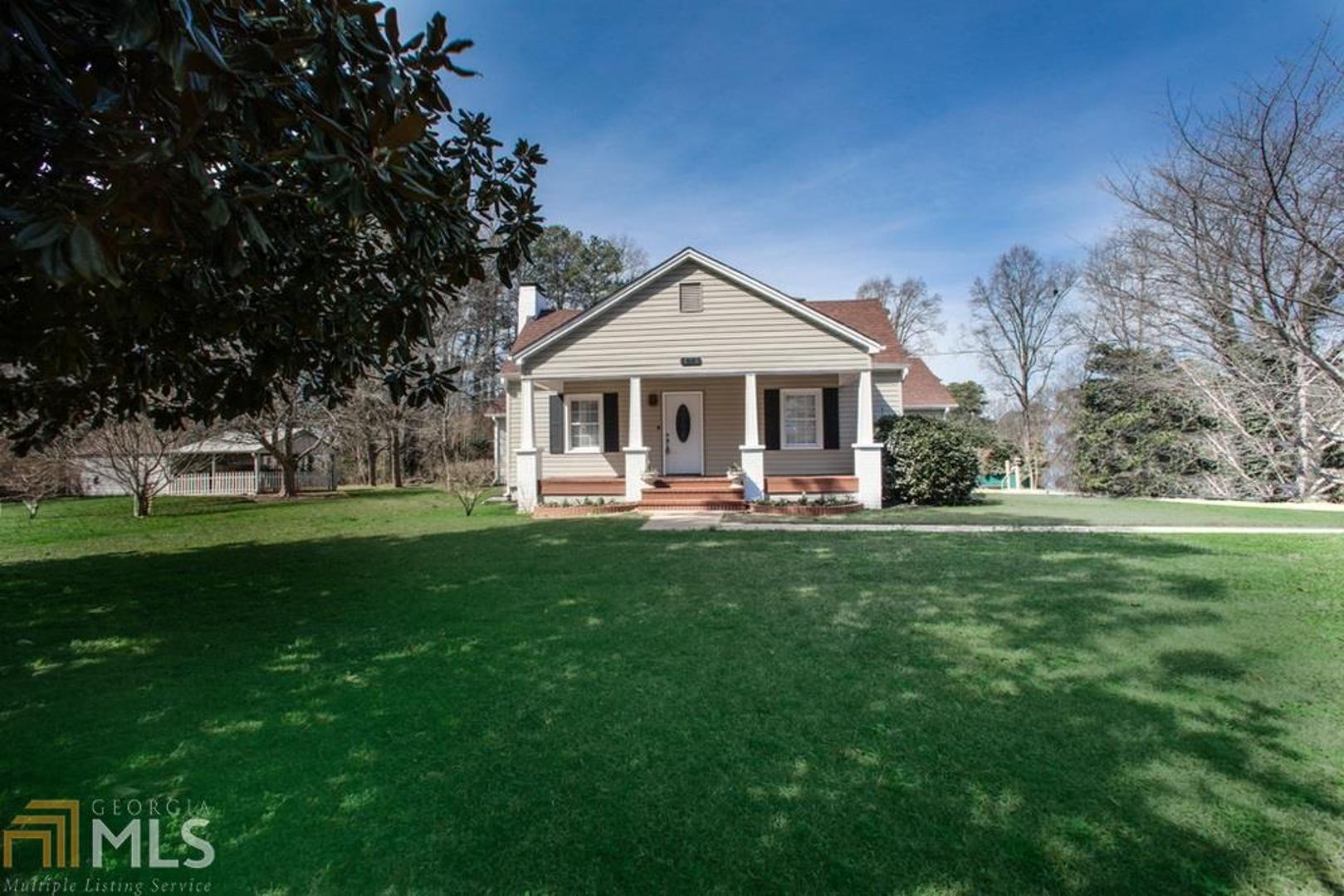 Beautifully renovated home in the heart of smyrna. A taste of country living, in Kings Springs Elementary School district and Campbell. Over 1 acre of land bearing 25 fruit and berry bushes.The original residence was built in the 30's and addition in 1995. Newer windows throughout. Storage abounds w/ 2 out buildings and stand-up attic over entire addition. Incredibly private and quiet! Great schools: King Springs Elem & Campbell IB. Silver comet extension runs right in front of the property! The original building still has the charm of the solid wood doors with glass knobs and 8 in baseboards.