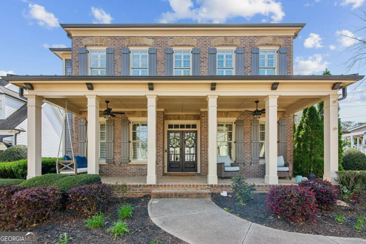 Discover 673 Dunbrody Drive, a beautifully designed 5-bedroom, 5-bathroom home with nearly 6,000 sq. ft.+/- of thoughtfully designed living space, located in the heart of MiltonCOs vibrant Crabapple District, this home blends high-end finishes with everyday functionality, making it a standout in style, purpose, and convenience. A welcoming front porch invites you inside, where an open-concept layout showcases soaring ceilings, custom millwork, and natural light. The spacious living room, central to the home, features built-in bookcases and a fireplace, offering a cozy atmosphere without feeling confined. Additionally, the formal dining area provides an upscale backdrop for gatherings, while the versatile main-level office/guest room makes working from home effortless. The kitchen is designed for both cooking and conversation, featuring top-tier appliances, quartzite countertops, custom cabinetry, and an oversized island. A butlerCOs pantry and walk-in pantry ensure plenty of storage, while the adjacent breakfast area offers a bright, inviting spot to start the day. The primary suite offers extra living space for a retreat-like feel and great light with large windows. A landing sits at the top of the stairs to serve as a staging area for all upstairs bedrooms and an extension of shared living space. Outdoors you'll enjoy a large, fenced backyard either from under the shade awning of the deck, or the dry patio underneath. It is a quiet, private escape while being just a step away from the community pool. This home is set in an unbeatable location within Crabapple's dining and shopping district, and easily walkable to seasonal events or just around the neighborhood lake. This home is truly the "best of everything" featuring top-rated schools, easy access to downtown Alpharetta and Avalon, and centrally located in Milton.