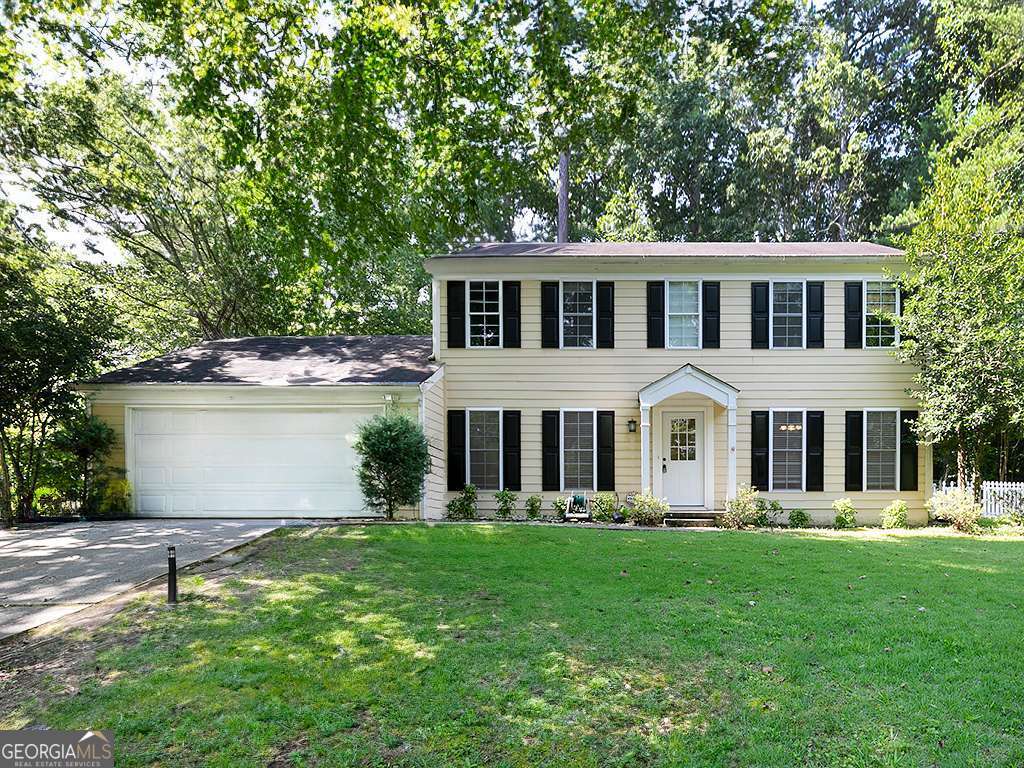 Welcome to this beautifully updated traditional home located in the heart of East Cobb. Zoned for the highly acclaimed Walton High School, this spacious and light-filled 3-bedroom, 2.5-bath residence offers modern comfort, timeless charm, and unbeatable convenience. The home features a flowing floor plan with an inviting foyer, formal living and dining rooms, and an expansive family room with a cozy wood-burning fireplace. The beautifully renovated kitchen boasts stainless steel appliances(including brand new gas stove), generous counter space, and a bright breakfast nook that overlooks the private backyard. Upstairs, the primary suite includes a walk-in closet and a private en-suite bath with dual vanities. Two additional bedrooms share a hall bath, and each room offers ample storage and natural light. BRAND NEW carpet in all bedrooms. Outdoor living is a dream with a newly landscaped yard and a spacious deck perfect for entertaining or relaxing. The lot provides plenty of space to enjoy the outdoors-all professionally maintained, as landscaping is included in the rent and paid for by the owner. Washer and dryer are included, and the TV in the primary bedroom will stay with the property for tenant use. Home is ready for immediate move-in. TESLA charger in the two-car garage. Don't miss this opportunity to live in one of East Cobb's most desirable SWIM/TENNIS neighborhoods!
