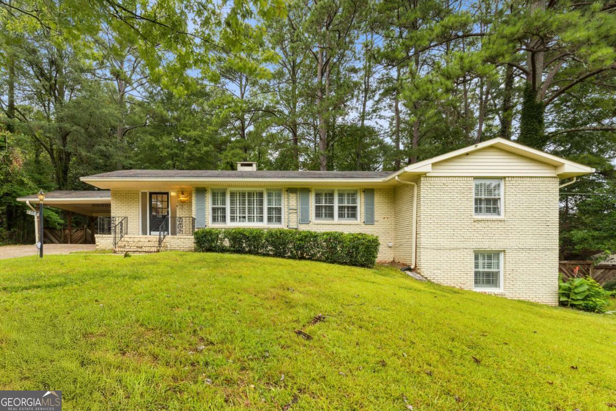 Great Investment or Spacious Home for a Large Family! This 6 bed, 3 bath property features 4 beds and 2 baths on the main level, plus a 2 bed, 1 bath finished basement-ideal for in-law suite or rental potential. Located in a quiet Stone Mountain neighborhood with easy access to major highways, schools, and Stone Mountain Park. Versatile floor plan with strong income potential or perfect for multi-generational living.