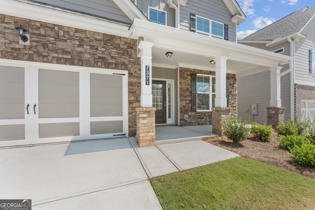 Photo of 7371 Rocklin Lane, Flowery Branch, GA 30542 (MLS # 10834316)