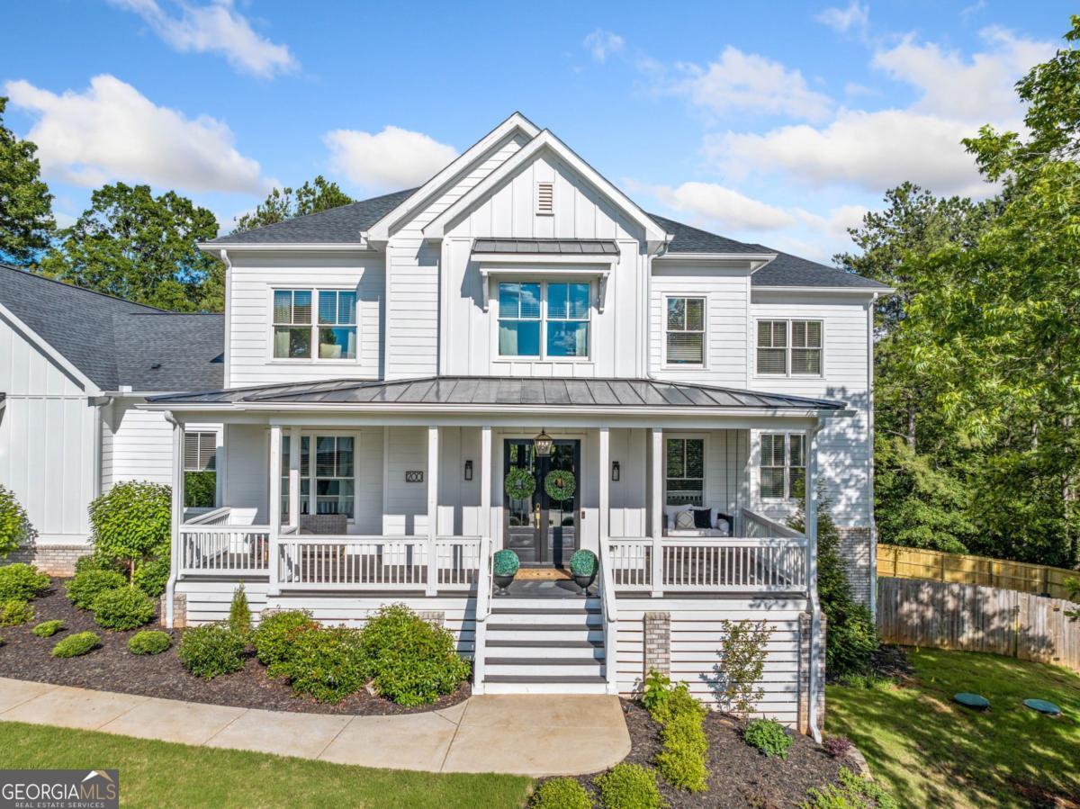 Price Improvement! Luxury Redefined in Woodstock - RESORT-STYLE LIVING with DESIGNER FINISHES, SALTWATER POOL & TRUE IN-LAW SUITE. Welcome home, where timeless design meets modern luxury in one of Woodstock's most coveted enclaves. Tucked away in one of Woodstock's most desirable areas, this like-new custom home is a true gem that checks every box for today's discerning buyer, not to mention this West facing home gets the most beautiful sunsets on the front porch. From the brand-new in-ground fiberglass saltwater pool to the meticulously finished terrace level, this exceptional residence offers a rare blend of architectural elegance, true multigenerational functionality, and resort-level outdoor living - all on a beautifully landscaped almost 1.5 acre lot with uncompromising privacy. Key Features of this STUNNING home: BRAND-NEW in-ground fiberglass saltwater heated pool and spa with custom hardscaping - a private backyard oasis ideal for entertaining or unwinding in style. True in-law suite (Teen Suite, Airbnb, or Income Producing Suite) with its own entrance within the 3-car garage. This space also includes a beautifully designed full kitchen complete with 2 beds, 2 full baths, office, living room, huge walk-in pantry, laundry room, plus your own private covered patio - all fully integrated and accessible from the main home or independently. 3-car garage is a must-have with private suite access plus generous storage in lower level. Chef's kitchen featuring quartz countertops, pot filler, oversized islands, and custom cabinetry. Designer-curated finishes throughout, including hand-selected tile work in baths and laundry, hardwood flooring, and California-style walk-in closets. Screened-in back porch with fireplace offering panoramic views of the pool and gardens - your year-round outdoor living room and perfect entertaining space. Beautifully designed dedicated office, massive upstairs flex/media room, and exercise suite that easily converts to a 7th bedroom or creative studio. All nestled in a quiet, established neighborhood just MINUTES from downtown Woodstock, top-rated schools, and private clubs. Schedule your private tour today!