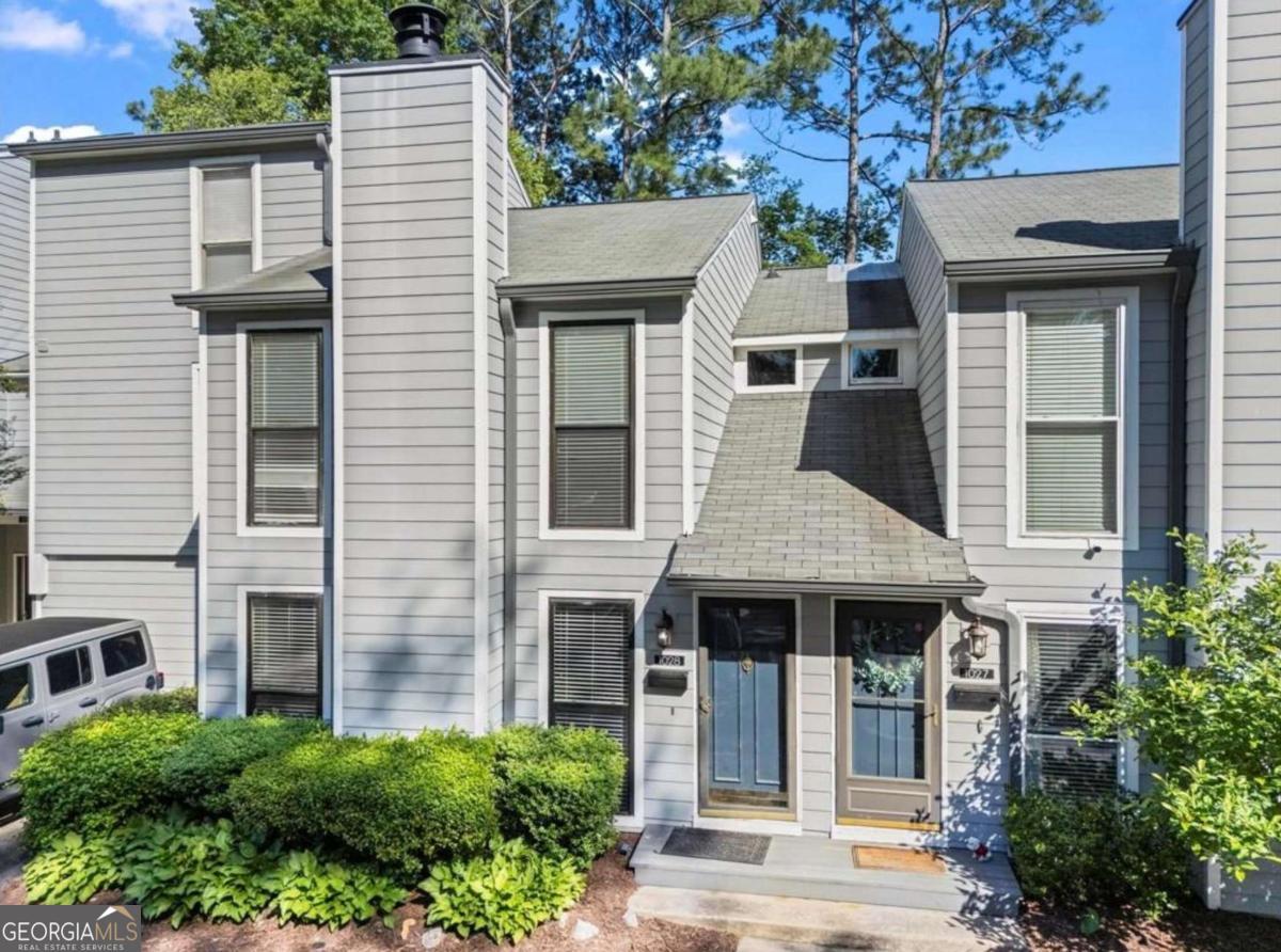 Live the riverfront lifestyle in this beautifully updated 2-bedroom, 2.5-bathroom townhome, ideally located along the Chattahoochee River and just minutes from Truist Park. Nestled in an active community, this home is perfect for outdoor enthusiasts-drop in your kayak right from the neighborhood, or hit the Sope Creek mountain biking trails just around the corner. Enjoy peaceful river views from the back deck, which features a built-in outdoor kitchen-perfect for entertaining or dining al fresco. French doors from the Dining Area open directly onto the deck, creating a seamless indoor-outdoor flow. Below, you'll find additional storage space ideal for bikes, kayaks, and gear. Inside, fresh new carpet and paint give the home a crisp, move-in-ready feel. The renovated primary bathroom adds a touch of luxury, while the main level layout offers both functionality and comfort. Whether you're looking for adventure or tranquility, this location delivers the best of both worlds. Don't miss your chance to own this unique riverfront retreat with easy access to recreation, dining, and entertainment. Investor Friendly.