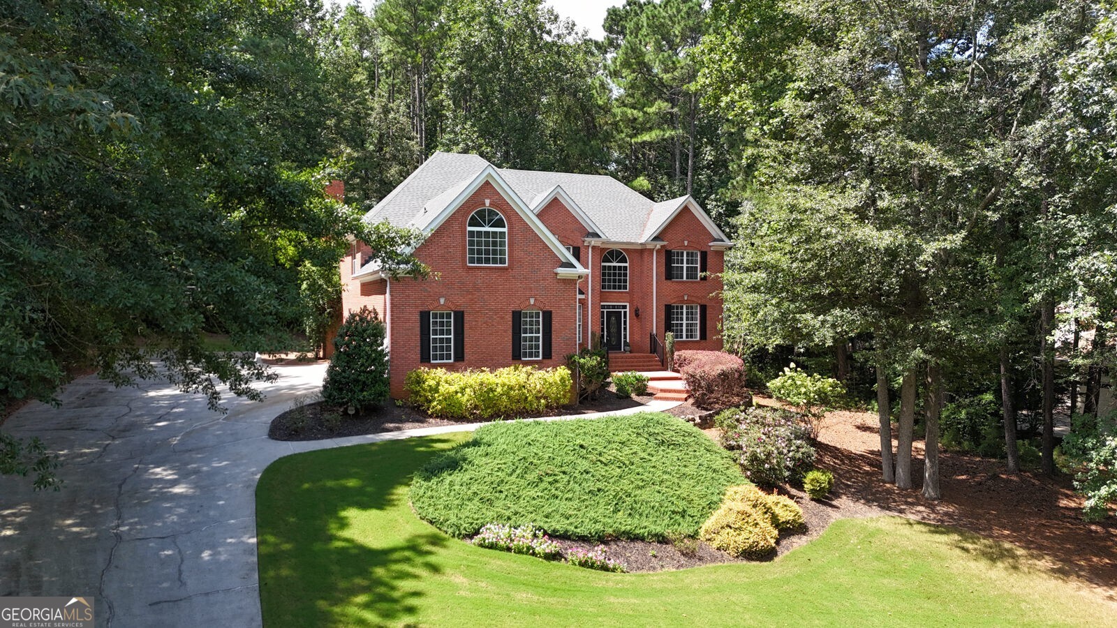 Welcome Home! Talk about VALUE in West Cobb! This 4-sided brick beauty sits in the highly sought-after Hill Rd area, tucked inside Stonegate -- a true executive community with estate-sized homesites. Step inside and you'll instantly notice the hardwoods, brand new carpeting and custom trim that make this home shine. The remodeled kitchen opens right into the two-story family room with fireplace -- the heart of the home. You'll LOVE the main-level office with a closet (hello, optional bedroom!). And let's not forget the laundry/mudroom right off the garage for real-life convenience. Upstairs you've got a stunning Owners retreat with Dual Sided Fireplace between the bedroom and sitting room! The Primary Bath is luxurious and ready for you to relax the days away! Three spacious secondary bedrooms, one with a private bath and the other two share a Jack & Jill bath. Need extra space? The terrace level checks all the boxes -- complete with a bedroom, full bath, and plenty of room for a teen suite, media room or the perfect in-law setup! Outside is your own private retreat -- a covered porch (that could easily go back to screened if you'd like!) overlooking a tree-lined backyard with firepit. Perfect for cozy nights or weekend gatherings. BONUS Features You'll Appreciate: Two newer HVAC systems with Nest thermostats, Newer architectural shingle roof, Oversized 3-car side-entry garage with epoxy floors, Central vacuum system Extended parking pad + championship basketball goal, Invisible pet fence. All in a top-rated school district, this home truly has it all -- space, upgrades, location, and community. Don't miss your chance to call 5327 Saville Drive HOME!
