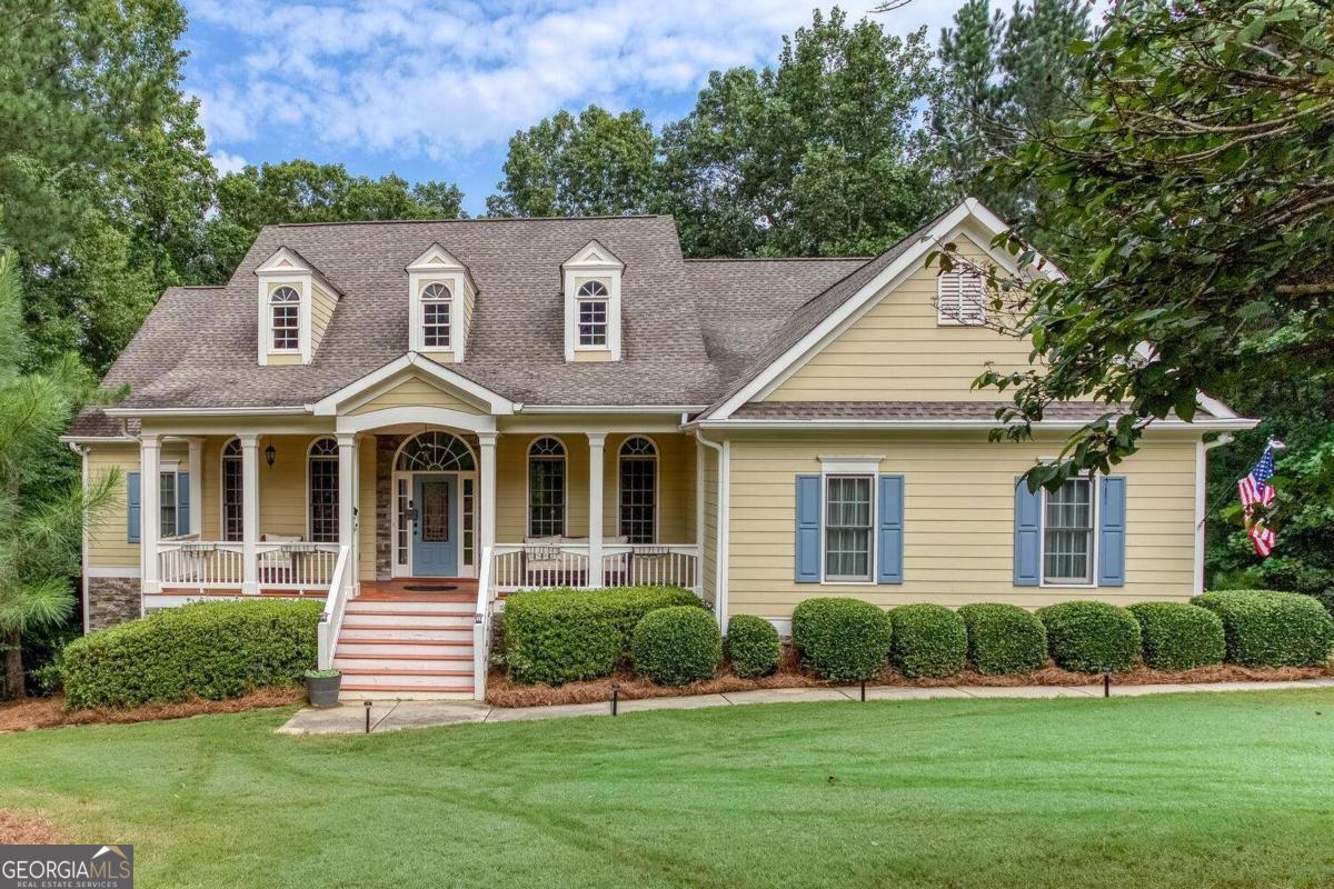 Welcome to your 6 bedroom, 4 and 1/2 bath craftsman style home on a full 2+ acres! From your front door you are immediately greeted by beautiful hardwood floors, formal dining room to your right and a sitting room to your left. Continue on through the elegant accent columns to your spacious living room with high coffered ceilings, stone fireplace, and numerous large windows for natural light. Circle through to your eat-in kitchen featuring rich wood cabinets, stainless steel appliances, sleek granite countertops, tile backsplash, gas cooktop, double oven, and breakfast bar. Your master bedroom on the main floor features a beautiful double tray ceiling and a door leading out to the back deck and screened porch. Master ensuite includes a double vanity with granite countertop, Jacuzzi tub, separate shower, and a large walk-in closet. Also on the main floor you have two other bedrooms, a full bathroom and half bathroom, spacious laundry room which includes plenty of cabinet space and a laundry sink! Upstairs you will find an additional large bedroom and full bathroom. Below, on the terrace level, you have so much space, tons of storage! There are two more bedrooms, a full bath, living room space, two large flex rooms with tile floors, a large unfinished area currently being used on one side as a workshop, and the other side as a home gym! This home has so much to offer! There is even a hot water circulation pump to give you instant hot water! From your double-decker porches and screened in porch enjoy your little slice of heaven, two+ acres of private forest retreat and wildlife all the way to the stream at the end of the property. All of this and just minutes from Waleska HWY 108 and HWY 515.