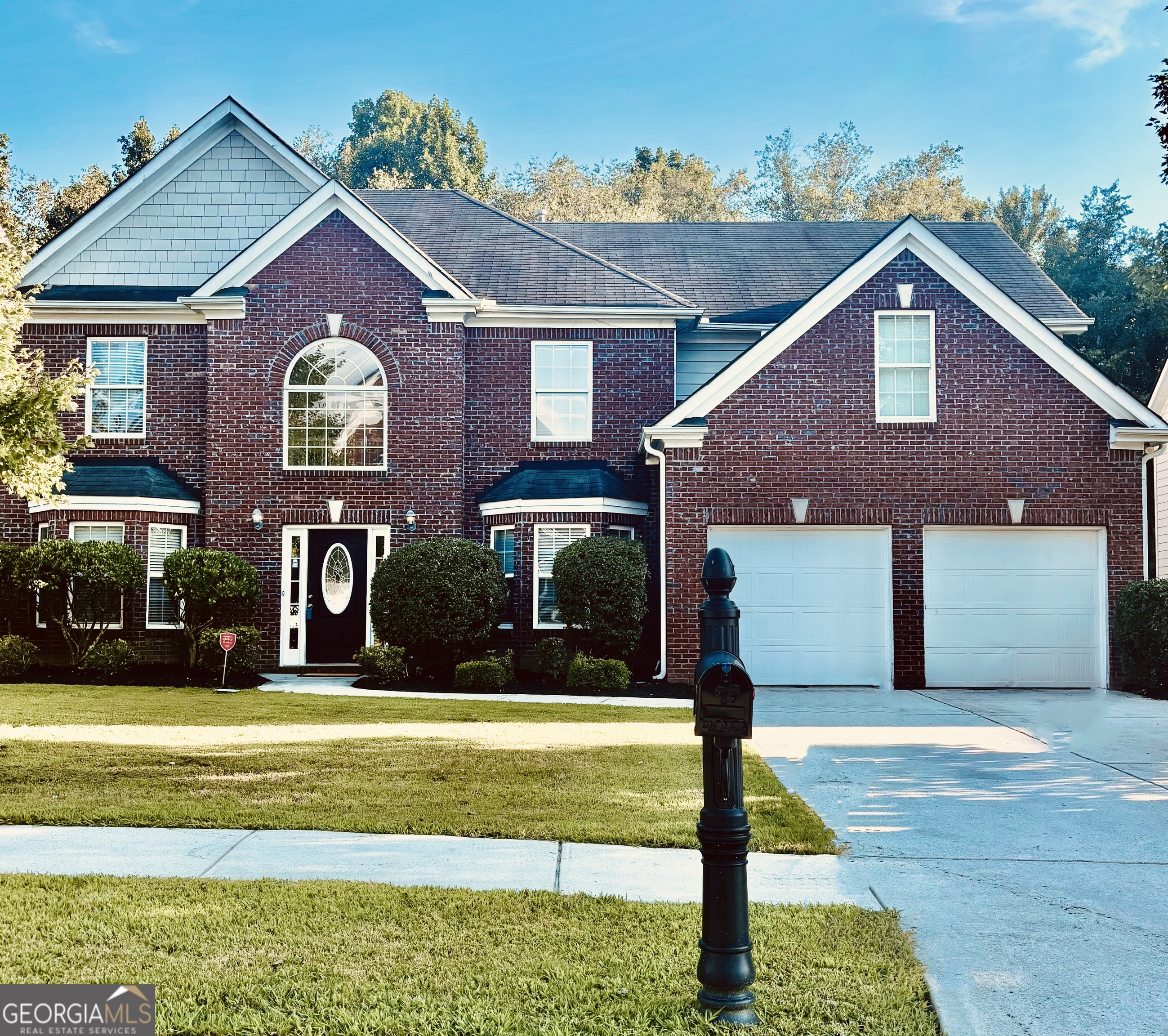Welcome to this beautiful 2-story brick-front home located in the highly desirable Oak Field Community within the Gwinnett County School District. This move-in ready home offers 4 bedrooms, 2.5 bathrooms, and generous living spaces perfect for both everyday comfort and entertaining. Interior Features: Elegant formal dining room and separate breakfast area, High-top counter bar ideal for casual dining and gatherings, durable and stylish LVP flooring throughout the main level, painted kitchen cabinets with ample storage and prep space. Striking foyer with painted columns and heavy trim detail`ing. Formal living room and a cozy family room with fireplace overlooking the backyard. Tons of closet space and storage throughout the home. The Owner's Suite offers very spacious primary bedroom featuring a fireplace and a private sitting area. Spa-like ensuite bath with a garden soaking tub, double vanity, standup shower, and private water closet, massive walk-in closet with room to spare. 3 well-sized secondary bedrooms upstairs, all with carpet, full hallway bath with tub/shower combo, convenient half bath on the main level, attached two-car garage. Located in a quiet, established neighborhood close to shopping, dining and entertainment. This home combines space, charm, and a fantastic location - everything yu've been looking for in Loganville! Call today to schedule your private showing!