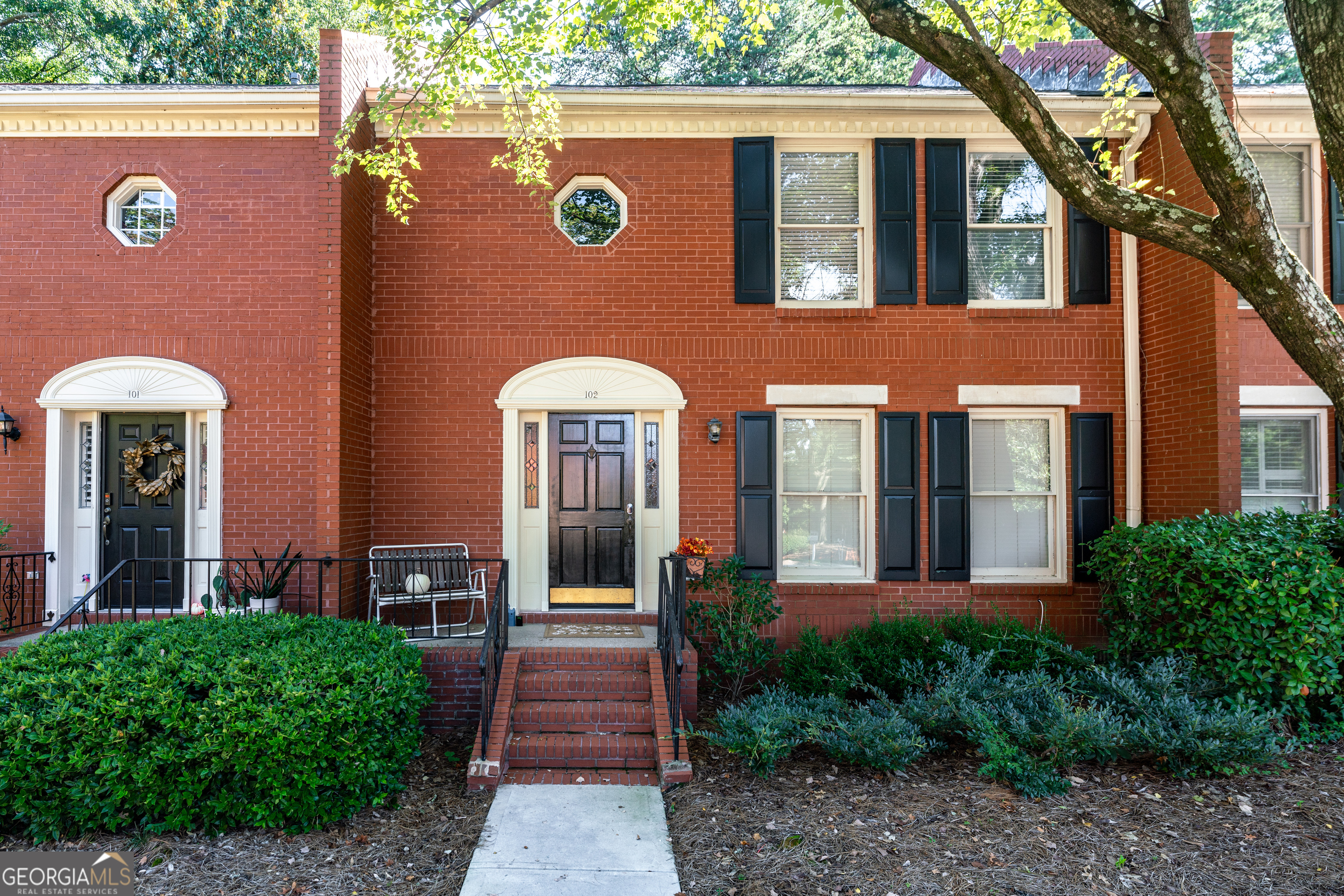 Adorable townhome in quiet Defoors Mill neighborhood featuring 2 spacious bedrooms, 2.5 bathrooms, refinished hardwood floors, tons of natural light, and ideal Upper West Side Atlanta location! One assigned parking spot with convenient guest parking readily available just steps from the cute front porch. As you enter inside, the large and well-lit family room is to the right. The real hardwood floors throughout the main level are in excellent condition and the windows in the dining area boast plantation style blinds. Updated light fixtures are found throughout this Defoors Mill gem. Enjoy stainless steel appliances, granite countertops, and a gas range in the kitchen with views to the private backyard. Dine al fresco on the fenced patio! The main level powder room is located next to the laundry closet that has a sweet peach accent wall. The primary bedroom upstairs is located at the back of the townhome and offers views of trees. We love the custom closet system and the beautiful tile shower. Across the hall is the second bedroom, also accommodating in size with an en suite single sink and shower/tub combo. The walk in closet has a window and shelving. All within minutes of parks, restaurants, entertainment, golf courses, shopping, and I-75/85.