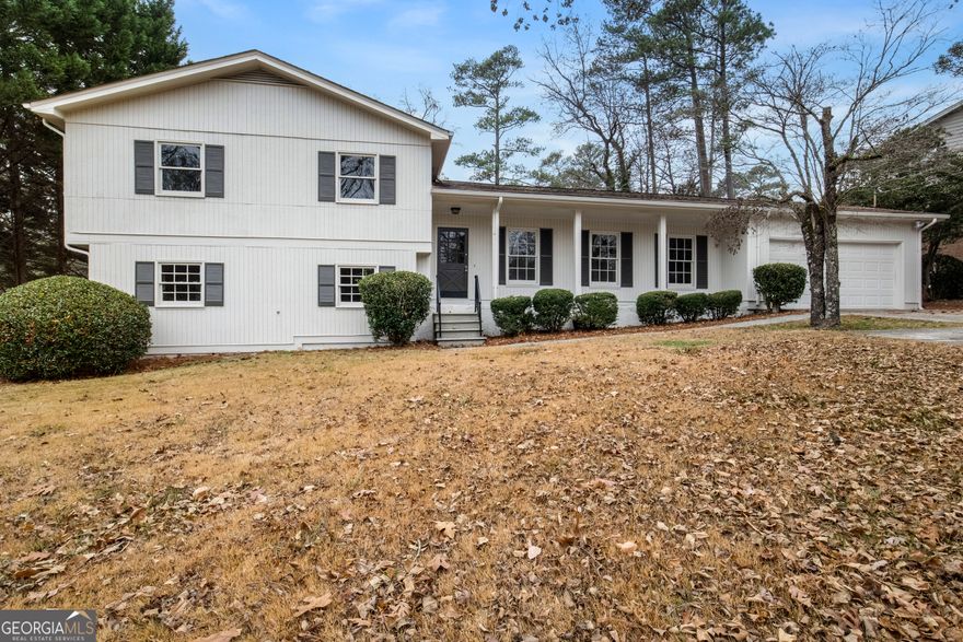 PRICED TO SELL!! Location, Location! TOTAL RENOVATION!! Top East Cobb Schools - Murdock, Dodgen, Pope! This wonderful split level home has just been completely remodeled painted and updated with a brand NEW KITCHEN and stainless appliances including refrigerator plus a very nice breakfast area. ALL THREE BATHROOMS ARE NEW and have also been remodeled with the most modern upgrades including a frameless shower in two of the baths. The main level space includes a living room, dining room and family room with fireplace with access to the updated deck and backyard. Terrace level has a huge multi use Bonus Room for playroom, office, fitness,TV room or whatever your needs may be! You will love the large backyard with plenty of room for children to play. Included with the home is an American Home Shield Home Warranty that was renewed in September 2024 and is transferable to the new owner! Close to loads of shopping, restaurants plus TOP schools and parks which makes this home an outstanding choice for your family! NO HOA!!