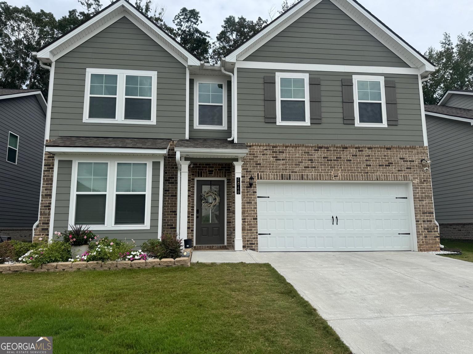 LOCATION, LOCATION! Spacious Home in Prime Fayetteville Location - Newly built home is situated on a quiet cul-de-sac in one of Fayetteville's most desirable neighborhoods. With over 3,171 square feet of thoughtfully designed living space and a private backyard featuring an outdoor kitchen, this home offers both style and comfort. The main level features an open-concept layout with hardwood-style flooring, seamlessly connecting the spacious family room and eat-in kitchen. There is a 1st floor bedroom and a full bath-perfect for families or guests. The kitchen is fully equipped with quartz countertops, a large island with breakfast bar, pantry, and stainless steel appliances (refrigerator, dishwasher, gas cooktop, double oven, built-in microwave, and disposal). Other highlights include recessed lighting, an electric log fireplace, a formal dining room with coffered ceiling, and a full-sized laundry room. Upstairs are 4 generously sized, carpeted bedrooms and 2 full bathrooms. The primary suite includes a walk-in closet, dual vanities, and a deep soaking tub. The additional bedrooms all offer bathroom access. Located in a High-rated school district: Spring Hill Elementary, Bennett Mill Middle, and Fayette County High. Best of all, this home is just a short walk to Publix for daily convenience, and minutes from Fayetteville's top amenities including the Line Creek Bus Barn (live music & events), Trillith Studios shops & restaurants, and the Fayetteville Amphitheater. Also convenient to Peachtree City, Senoia, I-85, and Hartsfield-Jackson International Airport. Don't miss this rare opportunity-schedule your showing today!