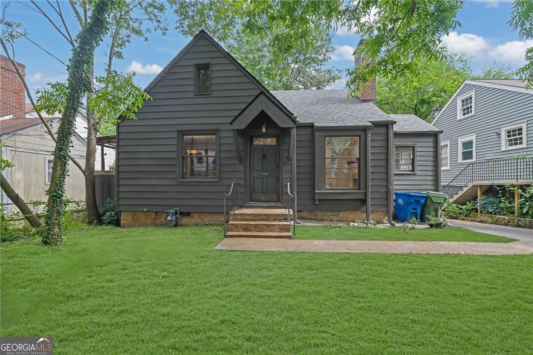 Location, Location! This charming cottage is tucked into North Ormewood Park and is just a block from Glenwood Park and within minutes from the EastSide BeltLine trail, Madison Yards, and East Atlanta Village. The main level has a large family room with fireplace, sunroom, breakfast room and large kitchen with stainless steel appliances, and two bedrooms with a full bathroom. Upstairs is a large room that can be a bedroom, office, playroom/craft room with a full bathroom. The backyard is huge and has a newly landscaped yard that is amazing with a fire pit and can be enjoyed after grilling out on the grilling deck. There is a large shed in the backyard as well so plenty of storage space and plenty of parking in driveway or off street.