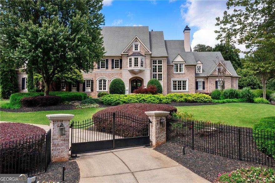 Truly one of AtlantaCOs most magnificent estate properties, this stately modern manor is quietly nestled on a cul-de-sac in an ultra-exclusive enclave of just 7 custom-built homes in the heart of Roswell. Professionally designed and completely transformed over the past few years, this brick home exudes exquisite modern detailing throughout. You're welcomed home by a stunning gated driveway winding through maturely landscaped grounds. Upon entering, a breathtaking two-story foyer w  a sweeping stairwell draws you and is highlighted by a steel+glass-enclosed wine cellar atop stunning chevron-patterned white oak floors. Luxurious living is redefined w  massive steel+glass doors opening from the Formal Living Room out to the Lanai which boasts coffered ceilings, stunning millwork, built-ins + a graceful fireplace (one of 6). The formal entertaining spaces graciously flow through to the Formal Dining Room and ButlerCOs Pantry. The massive chefCOs kitchen features floor-to-ceiling cabinetry, a side-by-side SubZero refrigerator freezer, an oversized pantry concealed behind hidden doors plus too many other high-end details to list. The massive island + idyllic breakfast nook overlooks the Family Room adorned w  exposed cedar beamed ceilings, a stunning fireplace, custom built-in bookshelves, + French doors leading out to the heated Lanai and Outdoor Kitchen.  The other wing of the home features hands-down one of the most impressive OwnerCOs Suites we have ever seen. A massive sitting room welcomes you to a true venue for rest+relaxation w  its own fireplace and direct access to the yard. A morning bar is quietly tucked off the oversized bedroom and massive dual-dressing suites flank the spa-inspired bath. A soaking tub set in front of its own fireplace is the centerpiece of the spa bath with dual vanities, heated floors, dual water closets, and an impressive walk-around steam shower w  all the bells+whistles. A paneled library serves as a work-from-home retreat + finishes the OwnerCOs wing of the home. A powder room, mudroom, laundry room, + 4-car garage round out the main living level.  Descend to the lower level and immerse yourself in lifeCOs finest luxuries. A massive lounge area is the heart of the Terrace Level w  a massive linear gas fireplace swathed in dramatic solid slabs of stone.  The downstairs kitchen is a modern masterpiece w  waterfall-edged quartzite counters + flat-paneled cabinetry. The BillardCOs Room features hand-plastered alligator textured walls and connects to a humidor room sealed off by massive steel+glass doors and w  its very own exterior access to the full-sized sports court. The Theatre rivals offers the most state-of-the-art home automation + the full-size bar is the ultimate venue for the consummate entertainer. An entire wellness center downstairs offers a private gym, sauna, + downstairs bath providing the ultimate escape from the everyday. Upstairs around the perimeter of the two-story foyer is a gallery walk+reading loft connecting a full in-laws apartment/au-pair suite w  the home's 3rd full kitchen and (4) additional en-suite bedrooms. All levels are seamlessly connected w  the private elevator + a secondary staircase. A majestic 2+ acre private yard serves as the idyllic background to this 15K sqft manse. A saltwater pool + jacuzzi are adorned with a waterfall overlooking the perfectly manicured grounds and private fire pit. A regulation-sized fully-lit sports court is perfect for those looking for the ultimate backyard recreation.  There is truly no detail overlooked w  high-end modern light fixtures, custom electronic window treatments and other high-design detailing throughout. A Creston smart home automation + surveillance system is designed at a level for the high-profile individuals who have previously called 570 Stonemoor Circle their home.  Located in the heart of Roswell with convenient access to all Atlanta offers there are not many homes that rival this one in the entire city.