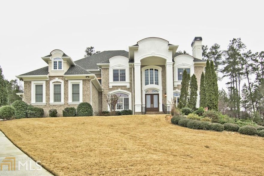 Beautiful spacious European estate located in a private enclave community. No HOA fees! Grand 2 story entrance with two arched stairways. Tray ceilings throughout the home. Chef's kitchen w/ Wolf appliances & sub-zero fridge overlooking a fireside keeping room with views to a spacious backyard ready for your custom pool to be added! Dual master bedroom floor plan; custom closets. Terrace level theater room, walk behind wet bar, spacious personal home gym and open areas for several gaming tables and entertainment space. Side daylight basement allows for a main levelwalkout to the backyard. Additional features include video security system, tri-level elevator, tesla charging station & more!