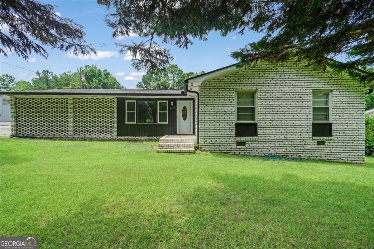 Stunning 3-bedroom 2-bath home just hit the market in Bremen!! This ranch-style home features 1184 sq ft of cozy living space. This home also boasts comfort, relaxation, and convenience. During the summer, entertain in the beautiful backyard space or relax near the fenced-in saltwater pool. This home also comes equipped with a Shed in the backyard with plenty of storage space. Located in the highly coveted Haralson County School District, it won't last long. Call Tiffany Lewis today to schedule an appointment to come see it! 404.671.0466! BY APPOINTMENT ONLY!