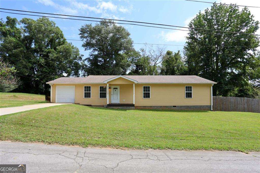 Welcome to 207 Van Wert St-a beautifully maintained ranch-style home built in 2013 with 3 bedrooms and 2 full baths, nestled on a level 0.3-acre lot. Designed with both comfort and convenience in mind, this well-appointed residence features energy-efficient windows and foam insulation for lower utility costs, along with modern upgrades including fresh paint, new carpet, new water heater and a recently installed HVAC system. The thoughtfully planned layout offers wide doorways and a stepless garage entry, making it fully accessible. Inside, discover an open living space that flows beautifully into the dining area and kitchen-perfect for daily living and entertaining. Each of the spacious bedrooms includes walk-in closets, delivering both ease and storage. Enjoy the freedom of a one-car attached garage with opener, and appreciate the quiet lifestyle and close proximity to downtown Buchanan's amenities and community events. Enjoy the private fenced backyard patio and enjoy the sounds of nature while drinking your morning coffee, this property. Move in ready!