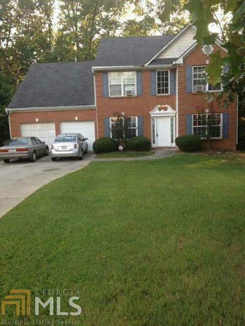 Spacious move-in ready 4 bedrooms with 2.5 baths. Home located in cul-de-sac. Family room opens to kitchen. Recently updated with laminated flooring on main and bedrooms. Separate living and dining rooms. Private wooded backyards. It wont last. Sold As Is
