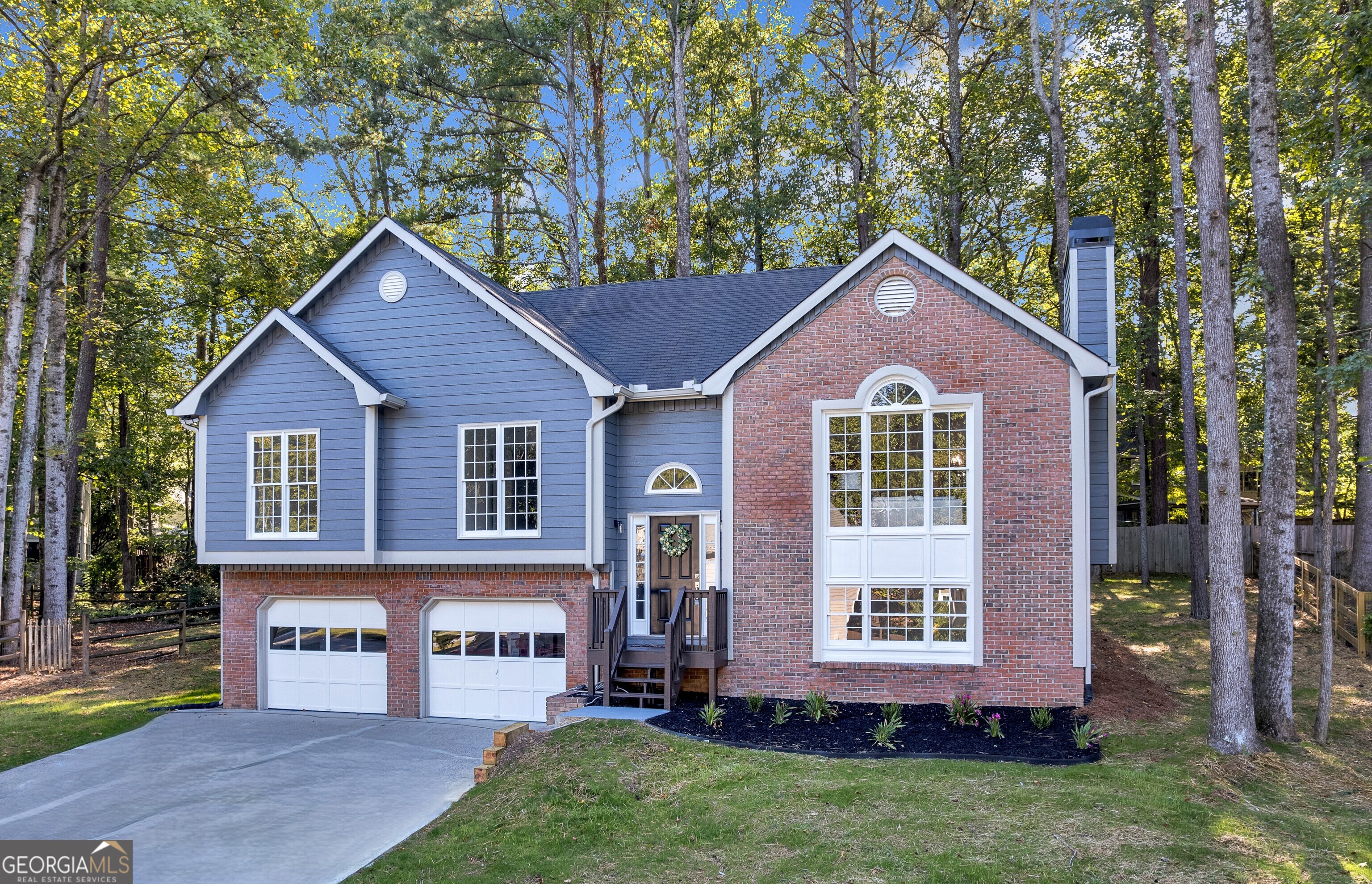 Welcome to your beautifully updated home in the sought-after Country Walk community of Powder Springs! This spacious 4-bedroom, 3-bathroom residence offers the perfect blend of comfort, style, and convenience. Recent updates include fresh interior and exterior paint, new carpet in bedrooms, refinished hardwood floors, updated light fixtures, and deck and porch maintenance, making this home truly move-in ready. Step inside to a light-filled main level featuring vaulted ceilings, a cozy gas fireplace in the living room, and a separate dining room ideal for entertaining. The eat-in kitchen boasts stone countertops, stained cabinets, and a pantry. The oversized primary suite on the main offers a walk-in closet and a bathroom with double vanity and separate tub/shower. Downstairs, a finished lower level includes an extra bedroom and bonus space, perfect for a media room, office, or guest suite. Enjoy the outdoors on your screened-in porch and private backyard, or take advantage of the resort-style amenities in Country Walk: swimming pool, tennis courts, clubhouse, playground, and direct access to the scenic Silver Comet Trail, perfect for walking, biking, or jogging. Located in a well-established, owner-occupied community with quick access to Atlanta, shopping, dining, and top-rated Cobb County schools. This home truly has it all and qualifies for $10,000 in FREE grant funds, with the Truist CHIP program!