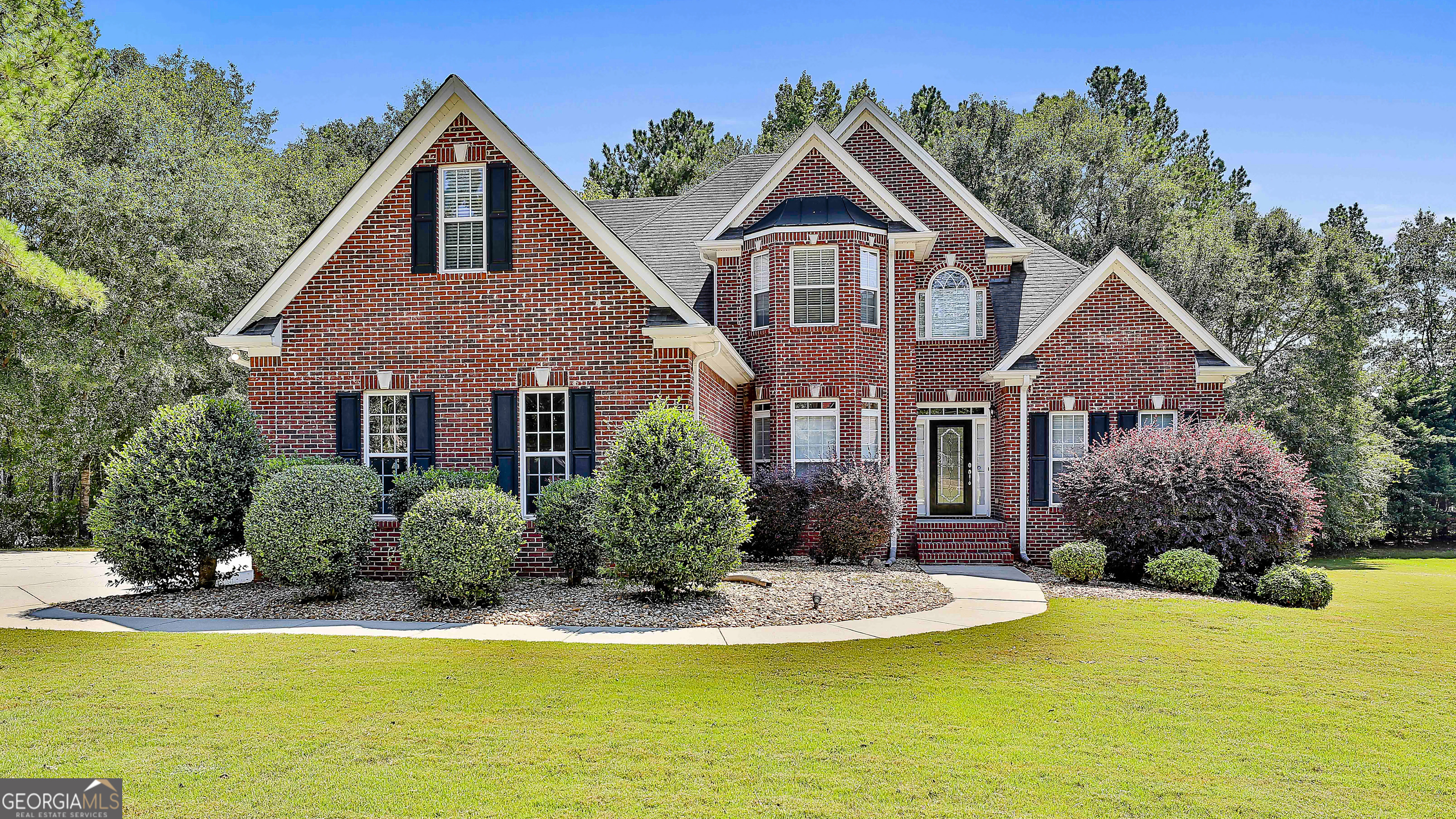 Welcome to this beautiful 7-bedroom, 4 full bath, and 2 half bath home, perfectly situated on a level 1-acre lot in the sought-after Union Grove school district. With a thoughtful layout and plenty of space, this property offers flexibility for a variety of living arrangements. The main level features a large eat-in kitchen with plenty of counter space, a separate dining room, a spacious living room with a fireplace, an office, 1.5 baths, a laundry room, and the primary suite. Upstairs, you'll find 3 additional bedrooms, 2 full baths, an office, and a large bonus room. The finished basement adds even more living options, with 2 bedrooms, 1.5 baths, a full kitchen, a full laundry room, a large family room, and a bonus room/office. With its private entrance, patio, and drive-around parking, this space is ideal for extended living, entertaining, or guests. This home combines solid construction, generous living areas, and is located on an established lot. Schedule your tour today and see everything this property has to offer.