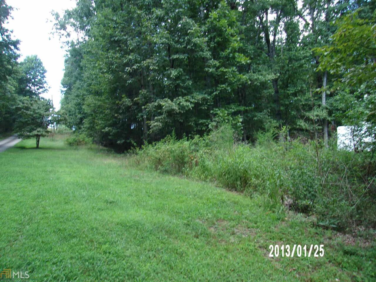 This 2.39 acre land lot is unrestricted with privacy. This is a great lot to build a house or set up a modular home. The property is located close to Cleveland, Helen, and Gainesville.