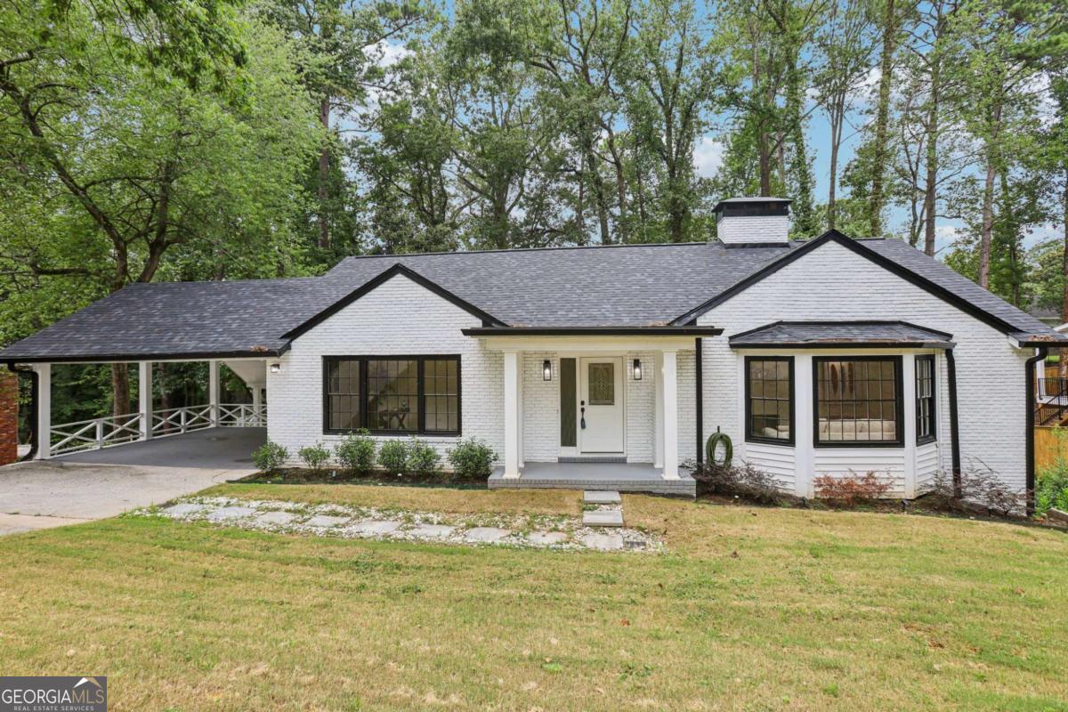 Welcome to 335 Amberidge Trail - a home where every detail has been reimagined to offer not just a place to live, but a place to thrive. Perfectly situated in a coveted location with effortless access to Atlanta's finest dining, shopping, and commuter routes, plus just minutes from top-rated schools, Sandy Springs City Center, and the Chattahoochee River - this residence blends timeless elegance with modern sophistication for a lifestyle that's both refined and convenient. Sunlight pours into open living spaces, highlighting stunning craftsmanship, fresh designer touches, and high-end finishes throughout. The chef's kitchen is a true showpiece, featuring beautiful stone counters, a striking herringbone backsplash, and a custom bar and coffee station for everything from lively evenings to slow weekend mornings. The seamless flow into the living and dining areas makes entertaining effortless, while the front living room offers flexible space for formal gatherings, a reading lounge, or a music room. A private office provides the perfect workspace or can easily be converted into a main-level suite for added flexibility. Ascend to your primary suite, offering a serene retreat with a spa-worthy bath, wrapped in rich Spanish porcelain. Two generously sized bedrooms and a hallway bathroom feature Brazilian porcelain and ceramic finishes that pair durability with luxury. The finished terrace level, with its own bath, delivers endless possibilities: guest suite, media lounge, gym, or creative studio. Outside, the expansive backyard transforms with the seasons, perfect for morning coffee, weekend garden parties, or evenings under the stars surrounded by nature. Move-in ready and thoughtfully designed, 335 Amberidge Trail is more than a home-it's a statement of style, comfort, and possibility.