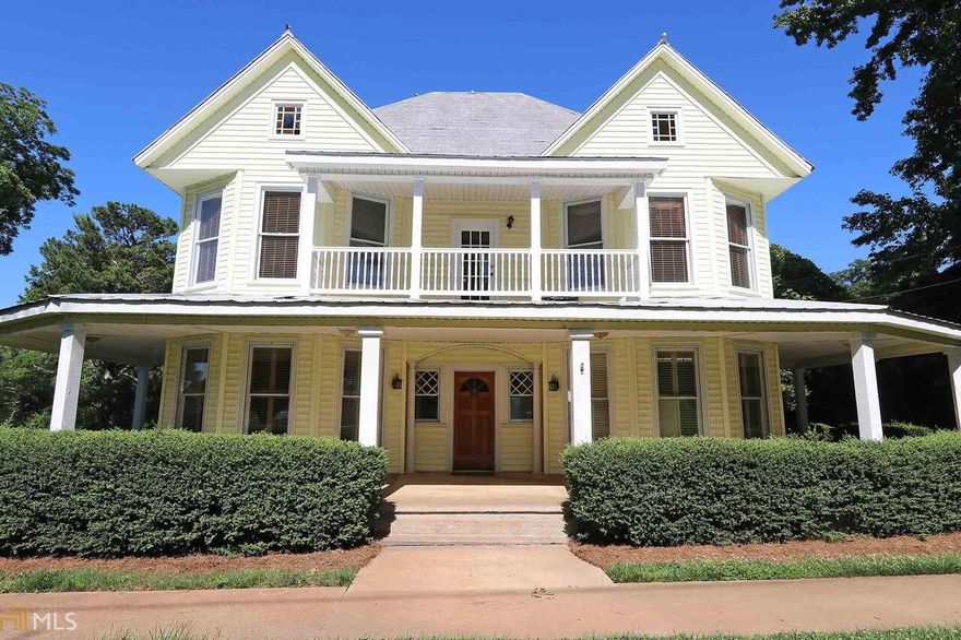 Gorgeous Victorian in downtown Jefferson zoned for Commercial or Residential!  Live upstairs & have business downstairs! Perfect for B&B (much needed in Jefferson), event facility, bakery, restaurant, medical ( formerly used as dental), retail, business offices or modify for spectacular home! In addition, there is a 4 car carport, circular drive, parking for 20 & gorgeous manicured acreage adjoining house. Upstairs offers large covered balcony& full kitchen. Space is easy to open- Would make great 2 unit condo! most walls not load bearing  Original Stained glass windows remain at entrance & attic. Huge covered front porch. Hdwd flrs under current flooring. The possibilities are endless at this one of a kind property in Jefferson. Owner financing considered!!