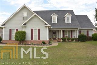 Very nice home conveniently located to Robins AFB, schools, shopping; beautifully landscaped yard with a privacy fence & 18X36 in-ground pool; wired outbuilding w/garage door; screened porch; new interior paint; great room w/gas fireplace; oversized kitchen/breakfast room w/lots of custom cabinets & solid surface counter tops; large master suite features bath w/jetted tub plus separate shower & two closets; 4th bedroom w/private bath upstairs; rocking chair front porch plus so much more...CALL!