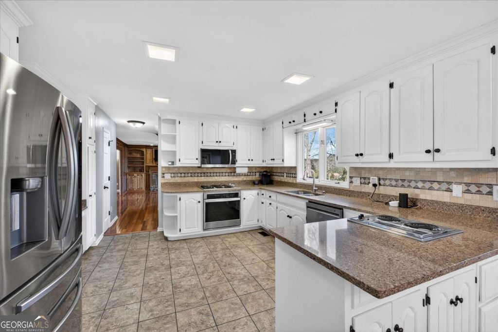 Photo of 1111 Honeysuckle Drive, Canton, GA 30114 (MLS # 10691421)