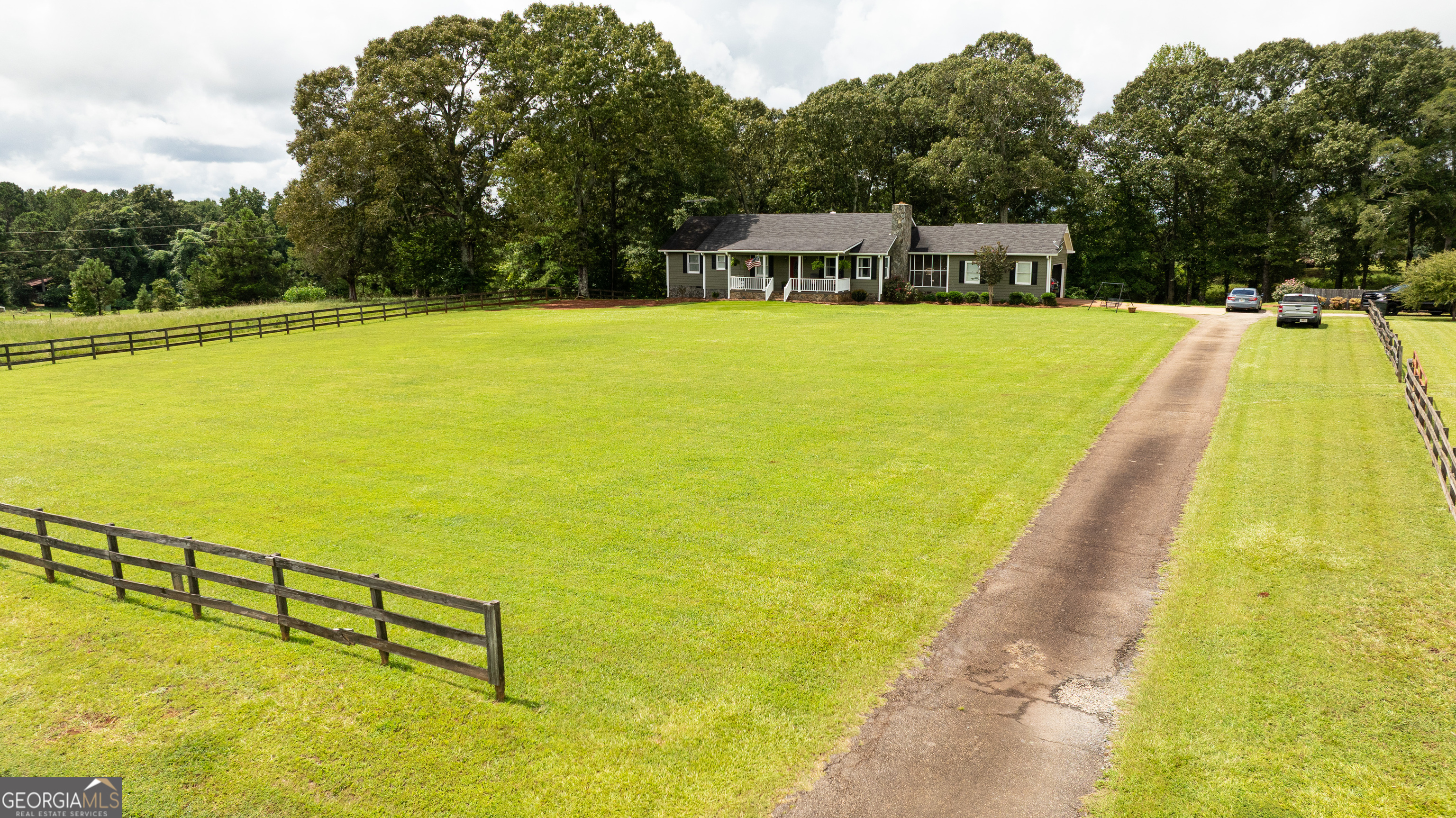 Your private retreat on the EAST side of Upson County awaits! Welcome home to this beautiful property set on five peaceful acres with all the space you've been dreaming of-both inside and out. Step onto the classic rocking chair front porch and into a spacious open floor plan that's perfect for gathering with family and friends. The living room features a striking fireplace as its centerpiece, while the beautifully updated kitchen makes both everyday meals and entertaining a joy. The main floor offers three bedrooms and two full bathrooms, including a comfortable primary suite, plus tons of storage throughout. Downstairs, the full walk-out basement expands your living space with two additional bedrooms, a home gym, a large living room, and another full bathroom-ideal for guests, family, or a private retreat. You'll also find generous storage options on this level as well, keeping everything neat and organized. Outside, the lifestyle continues: enjoy a sparkling inground pool with its own pool house, a large back deck, and a breezy screened-in porch that conveniently connects the home to the garage. There's also a separate shop for hobbies, storage, or workspace. Whether you're relaxing by the pool, enjoying a morning coffee on the porch, or hosting summer cookouts on the deck, this property offers endless ways to enjoy the outdoors-all just minutes from town on Upson County's desirable east side.