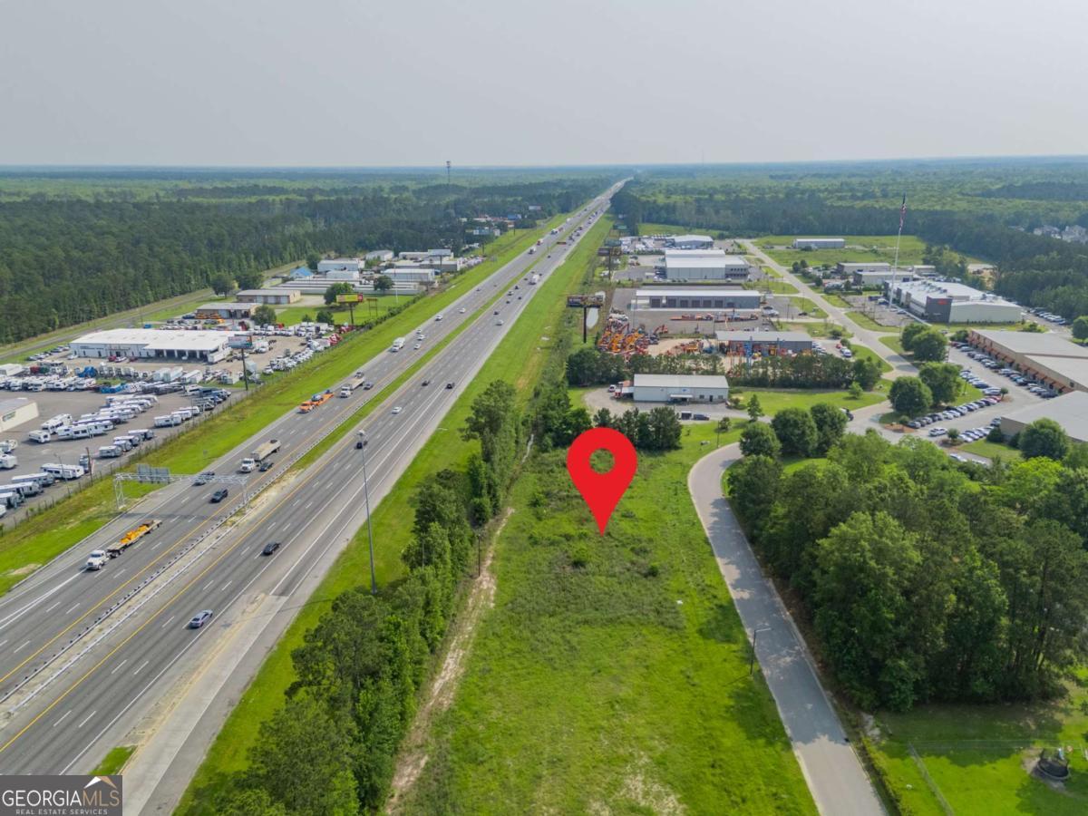 Prime Commercial Lot with Direct I-95 Exposure in Richmond Hill Unlock an exceptional opportunity with this 0.92-acre commercial lot located in the Ford Park of Commerce, just off I-95 at Exit 90 and minutes south of Savannah. Offering premier I-95 frontage, the property provides outstanding visibility and easy access within one of Coastal Georgia's fastest-growing commercial corridors. Zoned C3, the site is ideal for a wide range of uses, including retail, dining, office, light industrial, or warehouse development. Highlights: Direct I-95 frontage with excellent exposure Quick access to I-95, Highway 17, and Highway 144 Strong traffic counts in a high-growth corridor Established commercial park location with ongoing development Adjacent parcel (111 Thunderbird Dr) available for a combined 1.84 acres Whether you're a developer, investor, or business owner, this property offers a rare chance to secure prime land in a high-traffic, high-growth area of Richmond Hill.