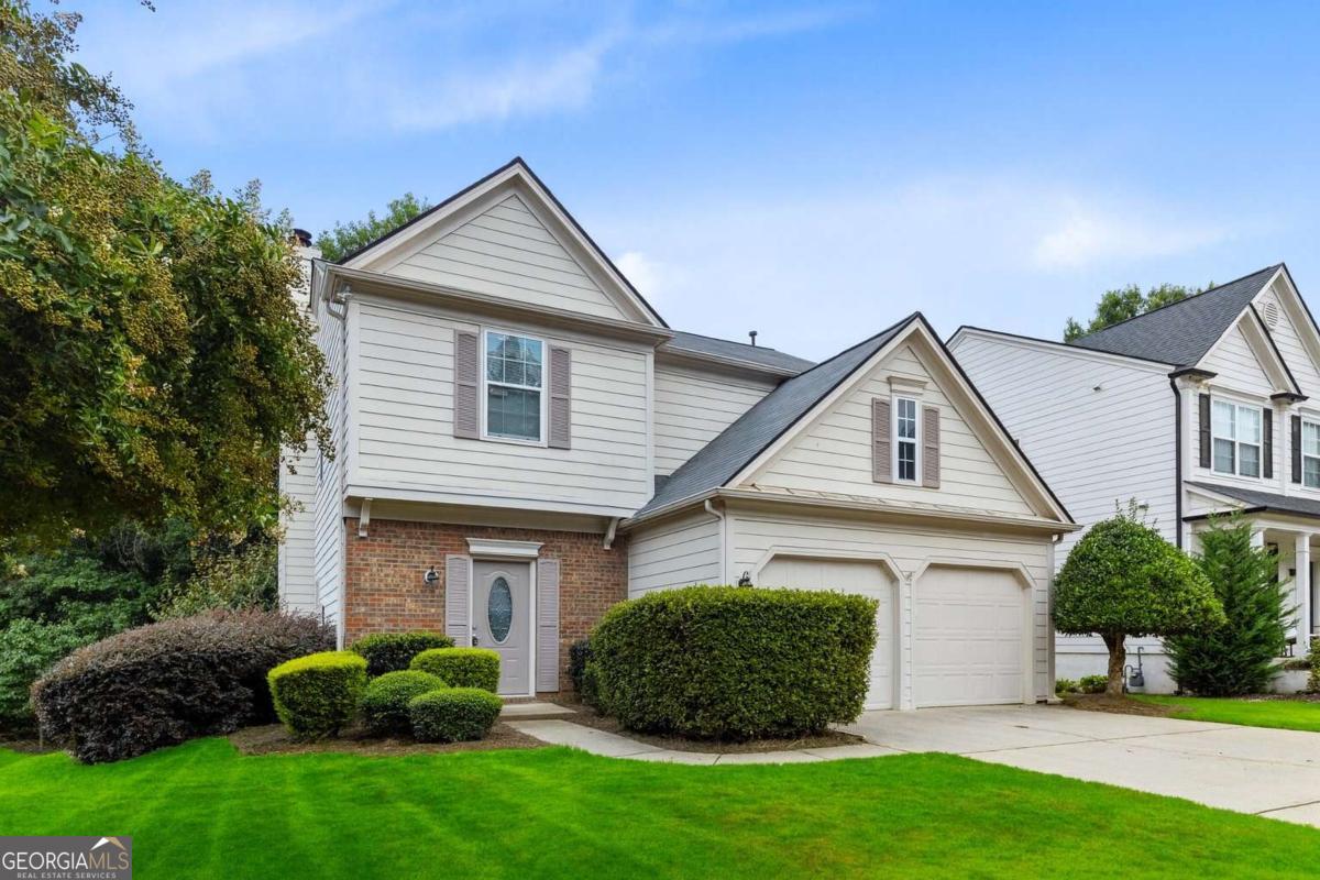 Welcome to this beautifully updated 3-bedroom, 2.5-bath home in one of Milton's most convenient and family-friendly neighborhoods. The fully renovated kitchen shines with brand-new countertops and luxury vinyl flooring, blending modern style with practical comfort. Enjoy hardwood floors throughout the main level, detailed millwork and trim, and a bright, open layout refreshed with new interior paint throughout. The home offers spacious double vanities in the bathrooms and generous walk-in closets, adding to the livability and appeal. Set on a large lot with ample yard space and nice separation between homes, this property provides privacy and curb appeal. Conveniently located near top-rated schools, shopping, dining, and parks. No rental restrictions make this an excellent investment opportunity as well as a perfect home for owner-occupants.