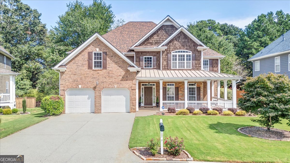 This meticulously maintained 5-bedroom, 4-bath home offers exceptional value-priced well below comparable properties. Step onto the large wraparound covered porch and into a gracious foyer that opens to a stunning two-story living room with a dramatic wall of windows and cozy fireplace. The open layout flows seamlessly into a HUGE kitchen, complete with a separate breakfast area and a keeping room featuring a second stacked-stone fireplace. The main level includes a guest bedroom with a full bath, perfect for visitors or multi-generational living. Upstairs, you'll find a spacious laundry room, four additional bedrooms, and three full baths. The oversized master suite boasts a spa-like bath and a large walk-in closet for ultimate comfort. The beautifully landscaped lot offers a serene and private oasis, perfect for outdoor entertaining and relaxation. Enjoy evenings around the fire pit, and a extra storage building in the backyard. Located in a desirable community with swim, tennis, and playground amenities, this home delivers the perfect blend of luxury, space, and convenience. Minutes from the Chattahoochee River and the Silver Comet Trail for outdoor enthusiasts, and situated just off I-285-you're only 15 minutes to the airport, 20 minutes to downtown, and close to Truist Park's vibrant entertainment scene, major highways, and nearby trails. Don't Miss Out! This stunning property won't last long-schedule your showing today and experience the epitome of luxury living!