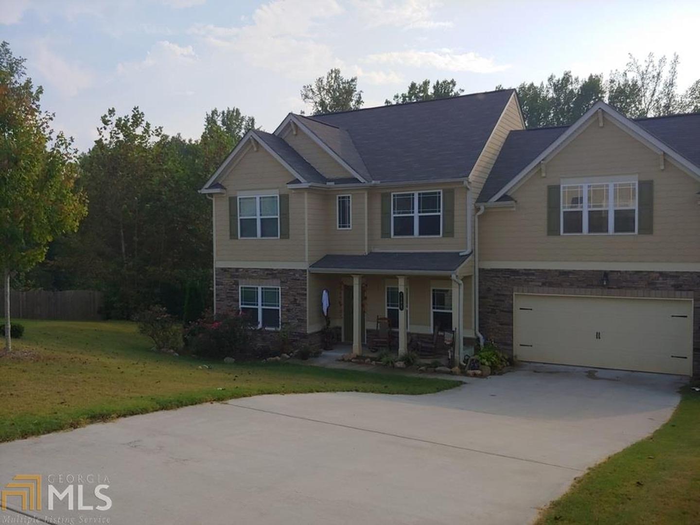 Stunning Douglasville 4 bedroom home on largest lot in Perennial Walk subdivision. Built in 2017 with wood floors in dining room, den and kitchen. Carpeting in family room and bedrooms. Laundry on 2nd floor along with 4 bedrooms. Master bedroom with large walk in closet. Master bath has stand alone shower and garden tub. Fenced in backyard with beautiful perennial gardens backing up to woods for total privacy.