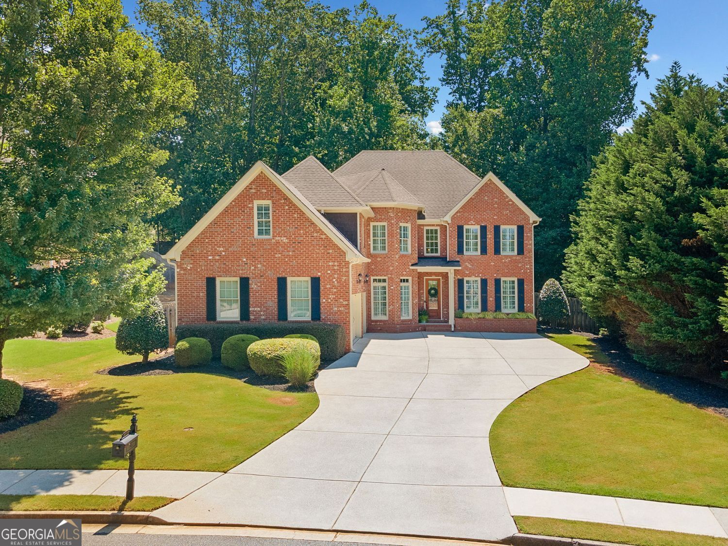 Welcome to 4550 Wigley Estates Road - a stylish executive home in East Cobb! This beautifully updated 3-sided brick residence offers the perfect blend of luxury, functionality, and location. Nestled on a private, flat, fully fenced lot with mature trees, this home features a 3-car garage and a spacious, thoughtfully designed floorplan ideal for modern living. Step inside to discover new LVP flooring throughout the main level, fresh neutral paint, and striking updated lighting fixtures. The home exudes contemporary elegance, with soaring ceilings and stylish finishes throughout. The powder bath has been fully remodeled and features a dramatic black Calacatta Monaco waterfall sink that makes a bold statement. The main level includes a dedicated office and a versatile guest suite with an ensuite bath - currently used as a home gym. Entertain effortlessly with a formal dining room, a spacious family room with an updated fireplace, an additional cozy sitting room, and a second updated fireplace for added charm. Culinary enthusiasts will appreciate the well-appointed kitchen, complete with stainless steel appliances, and ample cabinetry. Upstairs, retreat to the expansive primary suite with a serene sitting area, luxurious bathroom with his-and-hers vanities, a soaking tub, separate shower, and an impressively large walk-in closet. Two secondary bedrooms share a convenient Jack-and-Jill bath, while a third bedroom enjoys its own ensuite. A large bonus room completes the upper level - ideal as a media room or home theater. Located approximately a mile off Sandy Plains Road, this home is minutes from shopping, dining, and entertainment in both Downtown Woodstock and Downtown Roswell. Zoned for top-rated East Cobb schools, this property offers exceptional value and lifestyle in one the area's most sought-after communities. Stylish, spacious, and move-in ready, this one checks all the boxes. Come see it for yourself!