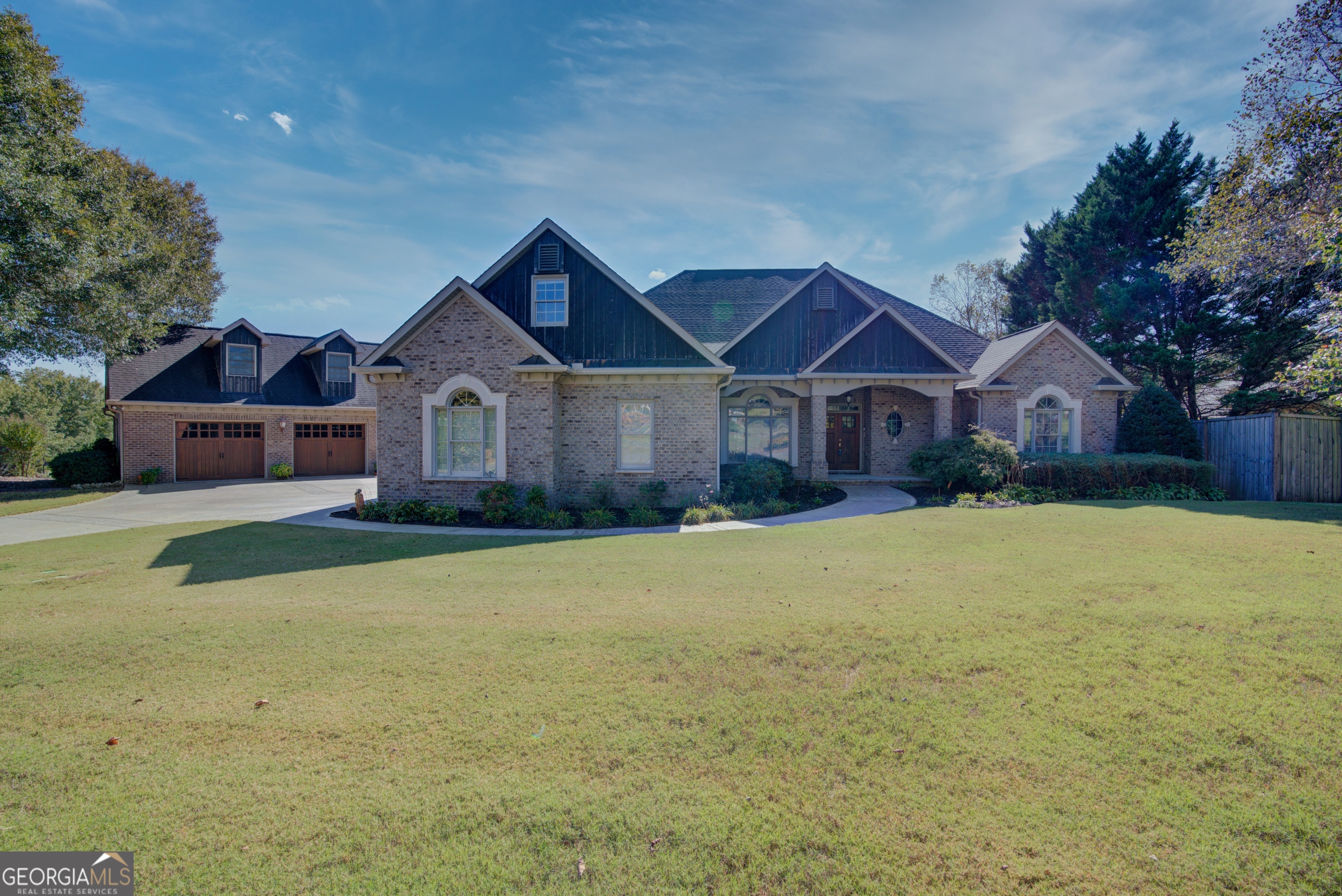 Reduced $50,000, this fabulous home located in desirable Etowah Ridge is a meticulously built custom home and it is a dream!! The home features premium upgrades throughout. As you enter the foyer you'll be greeted by by a beautiful dining room on your left. Moving forward you will find yourself in the family room highlighted by an elegant Texas limestone fireplace. The kitchen is a chef's delight with custom cabinetry, granite countertops, and top of the line stainless appliances. The master suite offers a luxurious retreat with a trey ceiling, and master bath that includes a separate shower and soaking jacuzzi tub, heated floor, along with his and her walk in closets. Three additional bedrooms on the opposite end of home with two full bathrooms. The laundry room adds convenience as you can enter from the mud area off the garage entry or from the master bath. A bonus room that is great for additional private space. Outdoor living is just as inviting with covered porch, inground pool, and a beautiful yard. The fenced back adds privacy and security, while the homes custom upgrades add to its overall appeal. Also on property is an oversized detached garage with workspace and parking. This also features an upstairs space with bedroom, bath and sitting area. Experience the perfect blend of comfort and beauty!!