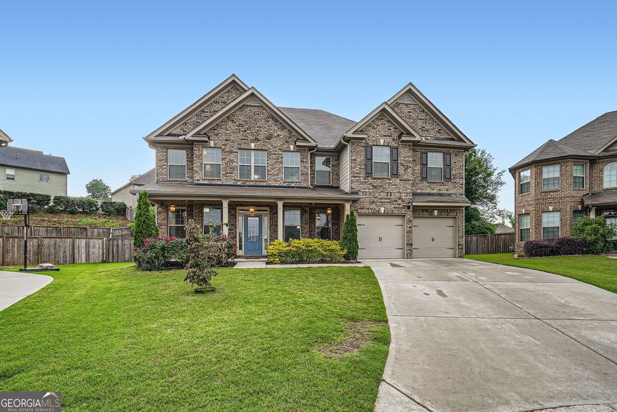 Welcome home to this spacious and family-friendly 5-bedroom, 4-bath home located on a quiet cul-de-sac lot in one of Forsyth County's top-rated school districts. This floorplan is the largest in the subdivision.    Brand new carpet throughout adds comfort and a fresh, updated feel.   With a bedroom and full bath on the main level, it's ideal for guests, in-laws, or a home office.    The heart of the home features an open-concept kitchen with granite countertops, ample cabinet space, and views to the cozy family room - perfect for everyday living and entertaining.    Upstairs, the oversized primary suite is a true retreat with a spa-like bath and a large sitting area, perfect for relaxing after a busy day. Three spacious secondary bedrooms have plenty room for the largest families.    Step outside to enjoy a covered patio and a beautiful outdoor firepit area, designed for family gatherings and making memories year-round.    This is the perfect place to grow, relax, and call home - don't miss it!