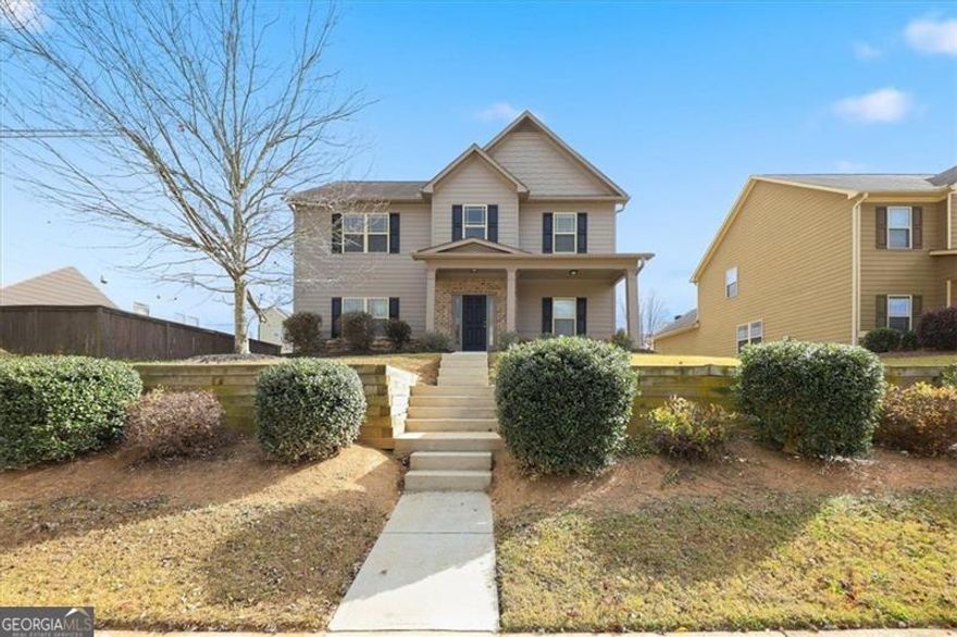 Welcome to this beautiful home with great curb appeal located in a desirable Braselton community. As you enter, the dining room sits to your right, leading into the open-concept kitchen and family room, perfect for entertaining or relaxing. The kitchen is equipped with stainless steel appliances, and the home features a combination of vinyl flooring, tile, and carpet throughout. A convenient first-floor bedroom and full bath offer flexibility for guests or a home office. Upstairs, you'll find the spacious primary suite, two additional bedrooms, and a laundry room for added convenience. Enjoy the open backyard, ideal for outdoor gatherings or future landscaping ideas.