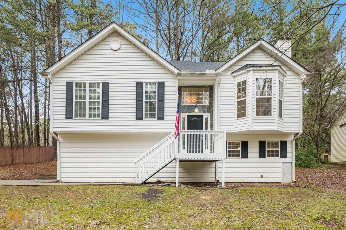 Welcome to this updated split foyer ranch on .93 acres! Enjoy the 6' wood back yard fence from the screened porch. New architectural shingled roof with ridge vents, low maintenance vinyl siding, newly refinished hardwood floors, new pad and carpet in the 3 main level bedrooms, granite counter tops, SS appliances, new faucets, fresh paint, epoxy coating on garage floor, fireplace with gas logs, large lower level bedroom with half bath, and more! We have 7 new windows coming Feb 10th to replace the ones that have broken seals. There is a 5 year termite warranty that is fully paid for, septic tank has been cleaned and inspected, duct work has been professionally cleaned, H/AC new in 2021. Come take a look at this move-in ready house!