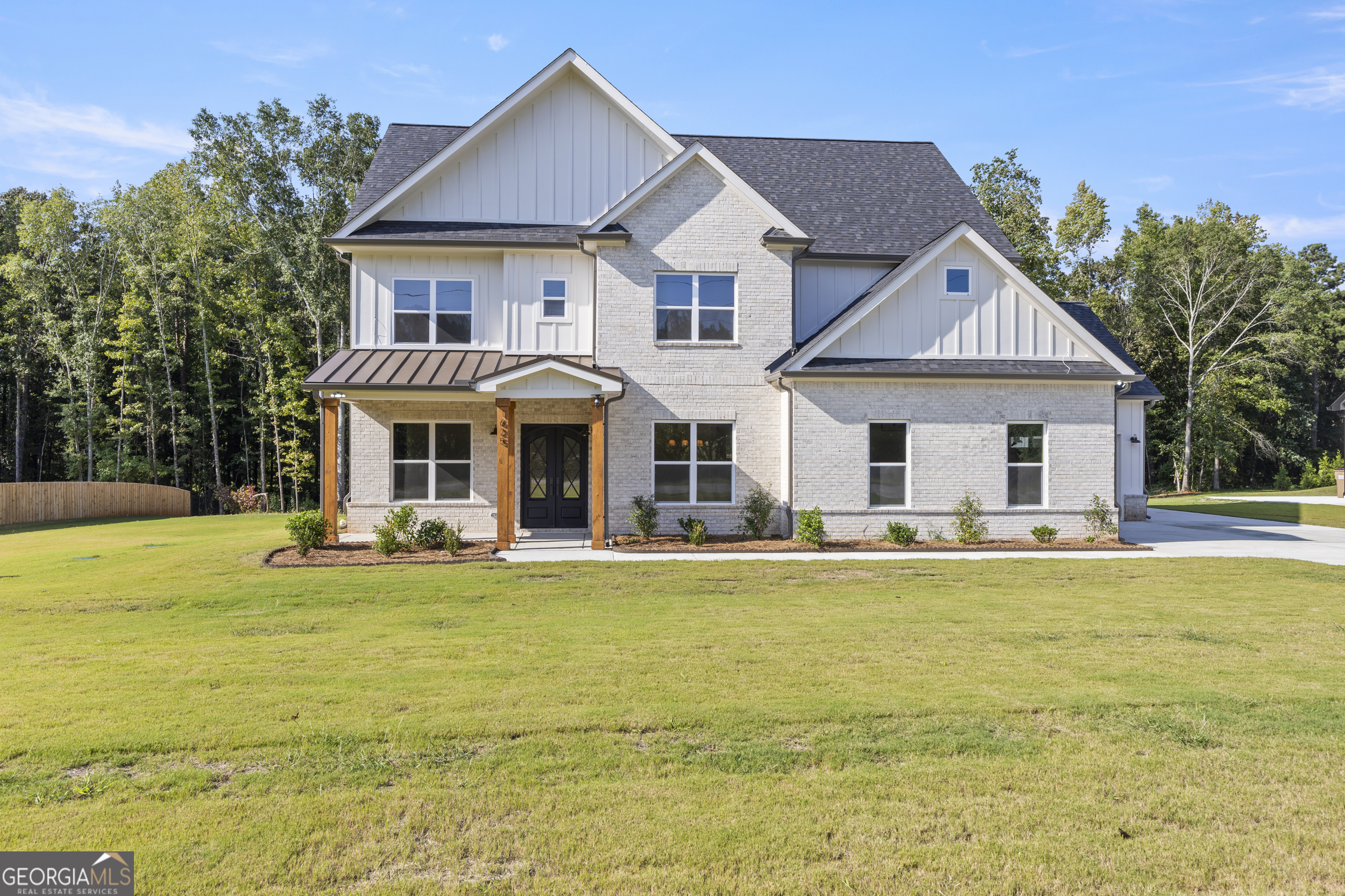 This beautiful brand-new construction home offers nearly 3,500 square feet of thoughtfully designed living space on a full acre with no HOA restrictions. Featuring 4 spacious bedrooms and 4 full baths, plus a versatile media room with a closet that could easily serve as a 5th bedroom, this home was built with both style and functionality in mind. The wide-open floor plan is perfect for gatherings and entertaining, highlighted by beautiful white oak hardwood floors and designer-selected finishes, including custom cabinets, curated fixtures, elegant tile, rich paint colors, and statement lighting throughout. Enjoy seamless indoor-outdoor living with a huge covered back patio and a welcoming covered front porch, each accented with real wood beams and custom wood ceilings for a truly custom touch. Blending luxury details with everyday livability, this property delivers both freedom and privacy-an opportunity to own a one-of-a-kind home without the constraints of an HOA.