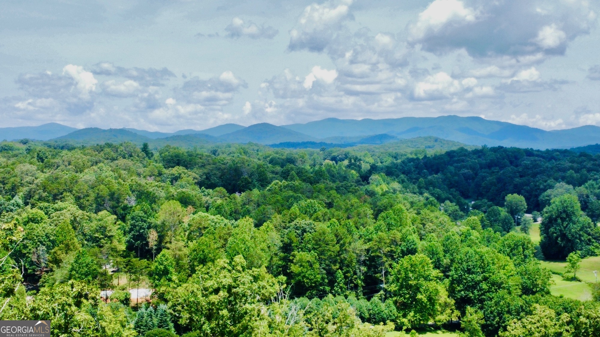 Discover Your Slice of Paradise in the North Georgia Mountains! Imagine waking up to breathtaking year-round MOUNTAIN VIEWS and ending your day with the same stunning scenery. This 1.06 acre lot is the perfect canvas for your dream home, nestled in a serene mountain community with only 23 lots. Enjoy wide paved roads, internet access, underground utilities, and public water, ensuring convenience and comfort. Also as a member of the community, you'll have access to High River Subdivision's Jakes's Landing Boat Launce with a pass purchase, great for water enthusiasts. Just minutes away from the charming town of Ellijay, you can enjoy shopping, dining, and local entertainment. Explore endless outdoor adventures with hiking, biking, and horseback riding, trails, as well as the stunning Carters Lake for all of your aquatic activities. Best of all, you're only 45 minutes from Atlanta, making this the ideal retreat that combines tranquility with accessibility. Don't wait-call your builder today, grab those house plans and turn your dream home into a reality.