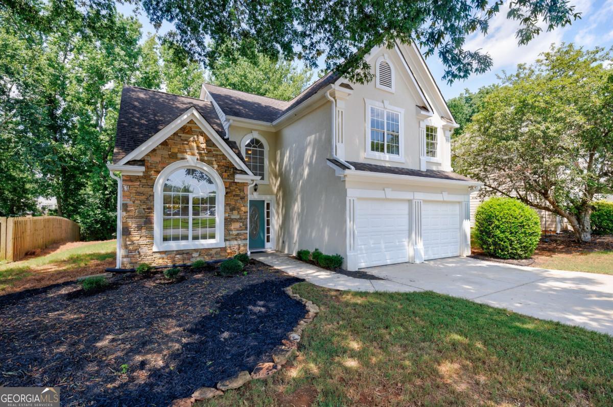Welcome home to this ideally located 3 bedroom, 2.5 bathroom traditional home with an open floor plan, situated in the highly sought-after Crabapple Creek neighborhood. This home is nestled in a swim/tennis community, less than 5 miles from Historic Roswell/Canton Street, Alpharetta City Center, and Avalon. The open floor plan boasts soaring ceilings that fill the space with light and warmth, overlooking the private backyard. The white kitchen seamlessly connects to the two-story fireside family room. The second level features a primary ensuite with a comfortable sitting area. The secondary bedrooms conveniently share a bathroom with their own private entry. The level driveway, yard, and patio provide excellent spaces for family and friends to gather and enjoy the private and serene backyard. Come make this home your own and enjoy the endless possibilities. You'll love living in this swim/tennis community with top-rated schools, just minutes from world-class shopping and dining. Upgrades: Approx. 2010 New Furnace, 2013 New Roof, 2013 New Gutters, 2019 New Siding, 2020 New Condenser and Evaporator (outside AC unit), 2024 New Water Heater