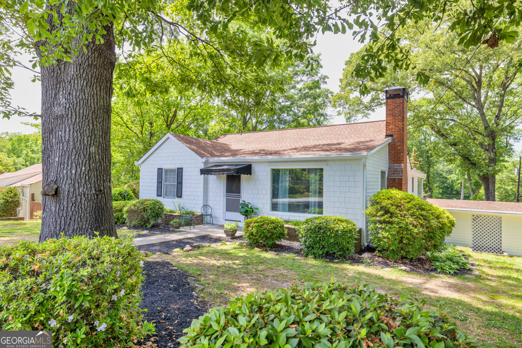 Welcome to 116 Northcutt St. in Marietta, GA! Nestled just moments away from the vibrant Marietta Square, this charming residence offers the ultimate in convenience and community charm where history meets hip! Step inside to discover a spacious living room with plenty of natural light and a beautiful wood burning fireplace. Fireworks can be enjoyed from the comfort of your living room sofa where the picture window provides a live view of the fireworks during festivals and and concerts throughout the year! This home offers 3 spacious bedrooms and 2 bathrooms because sharing is caring (but not always necessary). With a large dining room accessible from the living room, the space is ready to fit all your entertainment plans. The kitchen is equipped with beautiful new granite countertops, white cabinets and an eat in kitchen area ideal for the entire family. A stunning deck awaits you outside with unique glass shutters that provide the perfect blend of privacy and natural light! The basement bonus: envision a home theater, home gym, yoga studio or a home office to escape into your own private zone which includes a beautiful new full bath. Enjoy the sounds of nature or the vibrant atmosphere of Marietta Square, all from the comfort of your own home! You don't want to miss this opportunity!