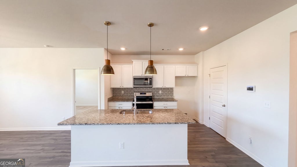 Photo of 8130 Highland Drive SW, Covington, GA 30014 (MLS # 10858331)