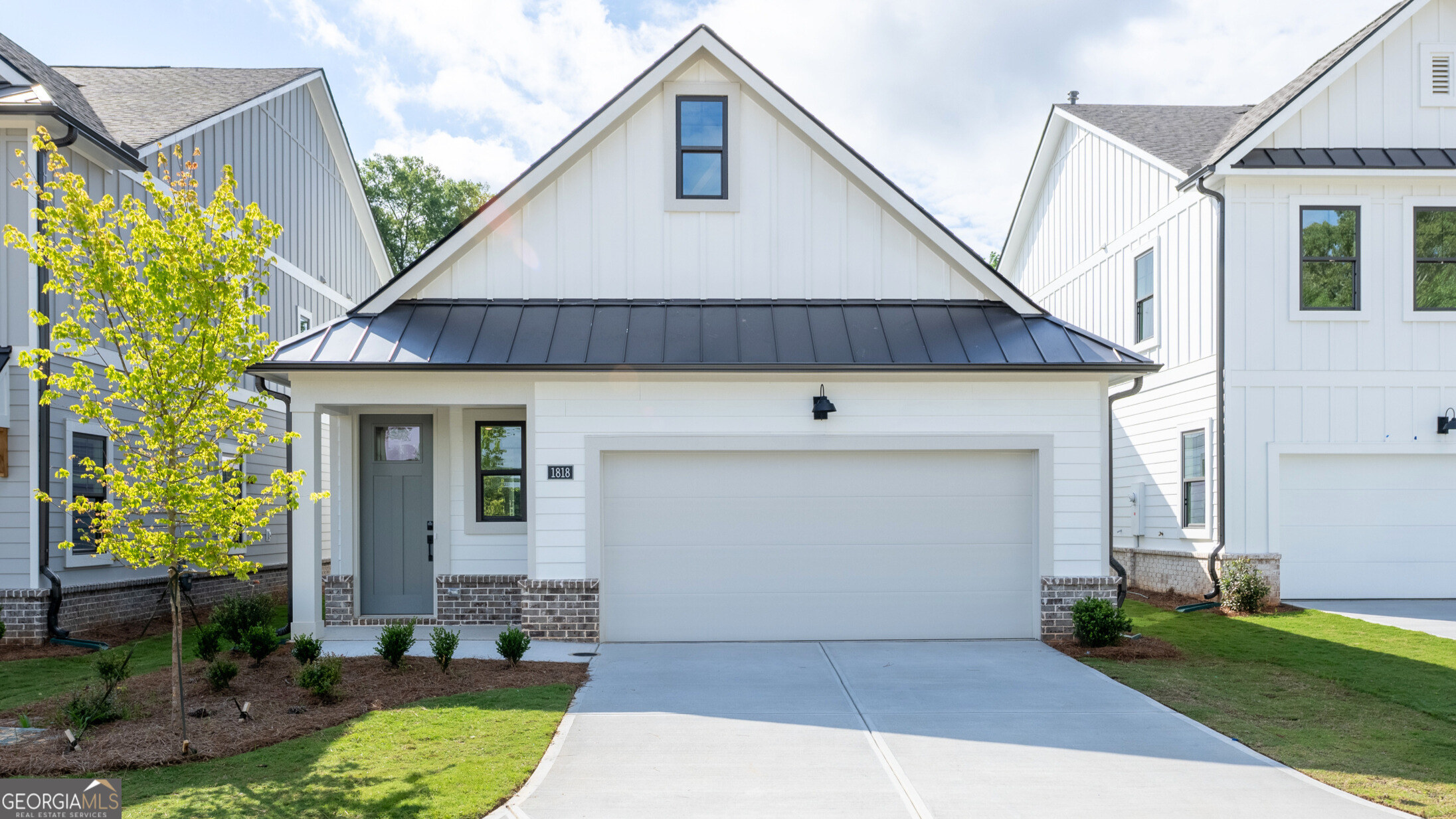 This captivating 1.5 story Bowen floorplan is nestled in the highly sought-after East Cobb area. Be one of the first homeowners in this prestigious gated community! Incredible open floor plan with the kitchen overlooking the dining and family room perfect for entertaining. The Bowen plan features a chef inspired gourmet kitchen w/ a island, Stainless steel appliance, quartz countertops and appliance package that includes an oversized cooktop, wall oven, wall microwave, custom wood hood complete with Revwood flooring throughout the main living spaces. Bedroom one and bedroom two are conveniently located on the main. Off the family room you will find a rear covered patio for outdoor living and front entry two-car garage. The upstairs features an additional bedroom and full bath with large walk in closet. This gated community features paver lined roads and amenities including pool, clubhouse and pocket park for residents' enjoyment. In addition to its tranquil and picturesque setting, homeowners will enjoy ease-of-access to Hwy 75 with, close proximity to shopping and eateries in Marietta as well as nearby trails and parks.