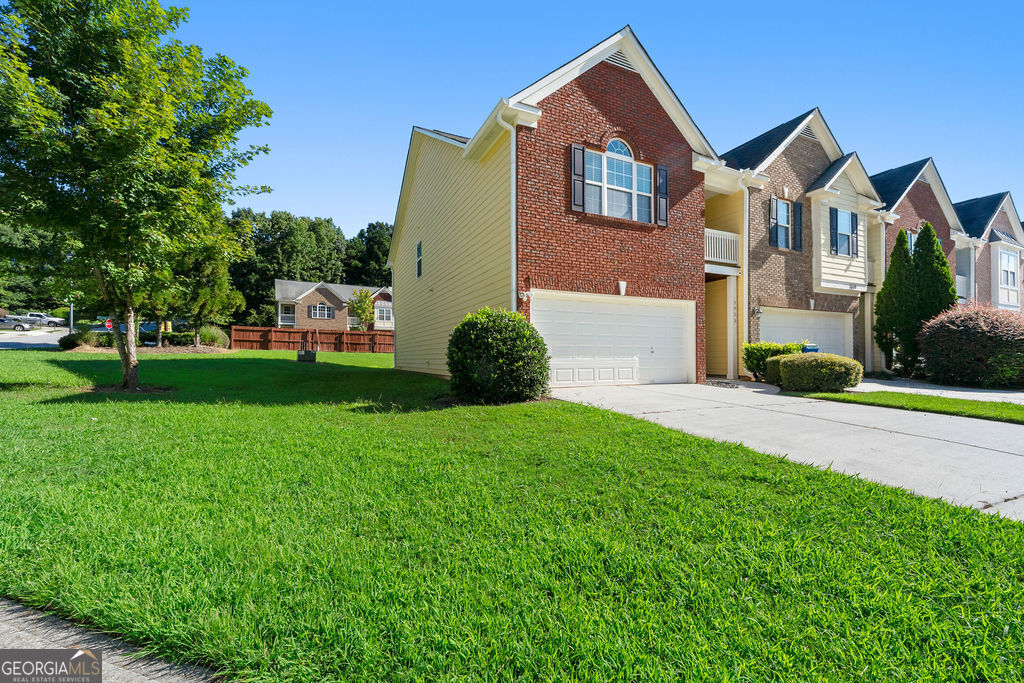 ! year of HOA dues PAID with accepted offer! Entering this spacious single owner townhome through the front door you'll find yourself in the nice sized foyer - which leads to the cozy living room with a corner fireplace. The kitchen has a small breakfast bar, spacious eating area that opens to the living room and provides access to the patio and partially fenced backyard. The laundry area is between the 2 car garage and kitchen. A half bath completes the first floor. All 4 bedrooms are upstairs. The master bedroom has a vaulted ceiling, a small balcony, TWO walk-in closets and an en suite with a soaking tub and separate shower. The three secondary bedrooms are good sized and share the full hall bath with a tub/shower combo. This end unit is located on the corner for extra outdoor space. Located with easy access to I85, shopping and more! Already inspected for buyer confidence. Priced below appraisal to allow for your updates!