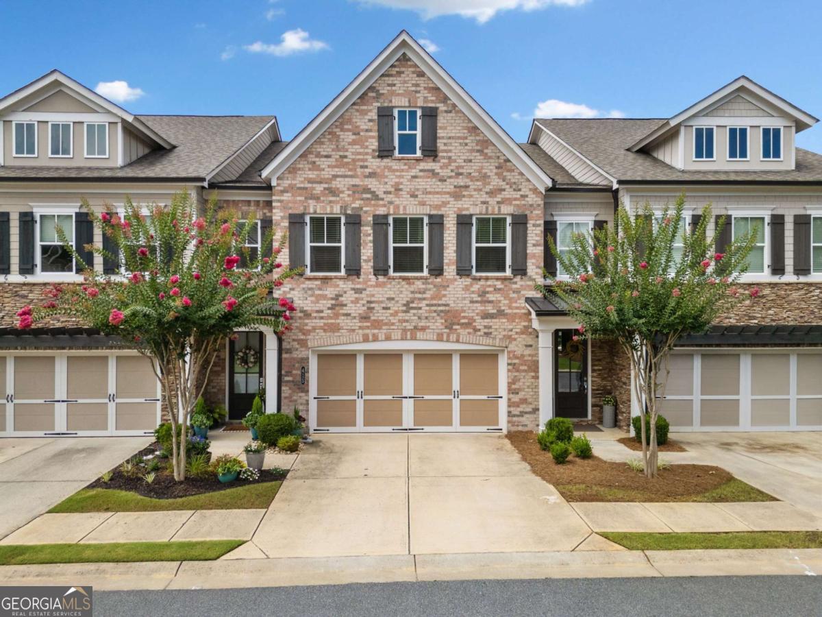 This beautifully maintained 3-bedroom, 2.5-bath townhome offers over 2,500 square feet of spacious, modern living. The open floor plan features hardwood floors, a cozy fireplace, and a gourmet kitchen with stainless steel appliances, granite countertops, and an oversized island-perfect for entertaining. Upstairs, you'll find a luxurious primary suite with a spa-like bath and generous closet space. Enjoy your morning coffee on the private covered patio or take advantage of the community amenities, including covered barbeque area and dog park. Conveniently located just minutes from vibrant Downtown Roswell and Downtown Woodstock, shopping, dining, and top-rated schools. This is low-maintenance living at its finest! Home has an elevator shaft if you want to have one installed.