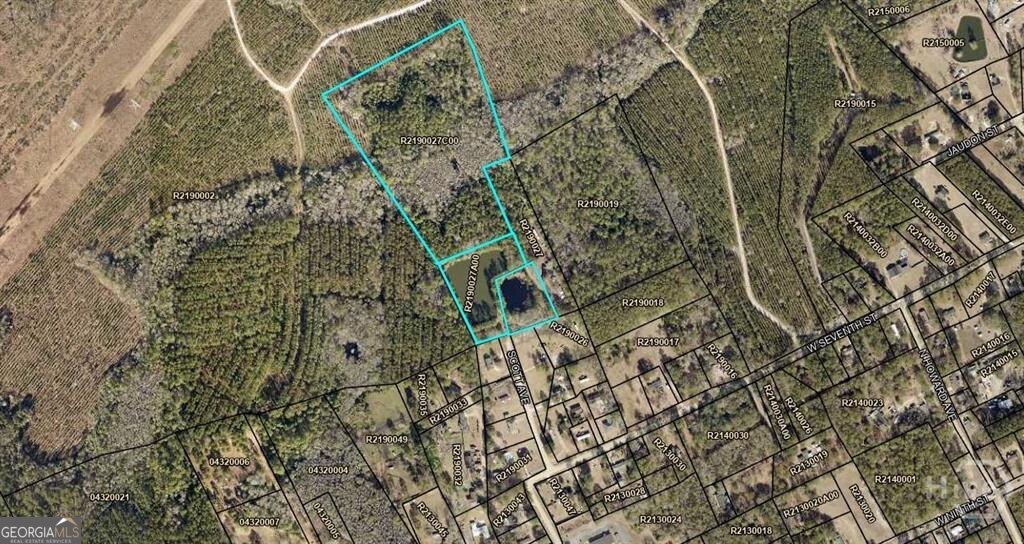 This property consists of three separate parcels. Parcel R2190027B00 (1.52)acres, Parcel R2190027A00 (2.91) acres, and Parcel R2190027C00 (11.70) acres. Two beautiful ponds are located on the property, just at the entrance. This would be a perfect place to build that build home or for development.