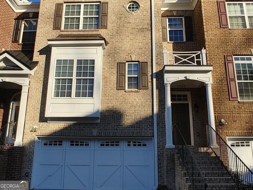 Sparkling and Pristine Executive-style 3 level townhome in awesome location. Close to shopping and dining on Windward Parkway, easy access to 400 and Hwy 9. fully equipped kitchen with stainless appliances, hardwood floors. Separate formal dining for those who entertain. Living room with fireplace. Each level boasts a patio or deck including the Master Suite which has a sitting room attached to its deck. Terrace level hosts an en-suite ideal for guests or roommate floor plan, but allows the option for those who work from home privacy. 2-car garage and wooded view off decks. No pets considered.