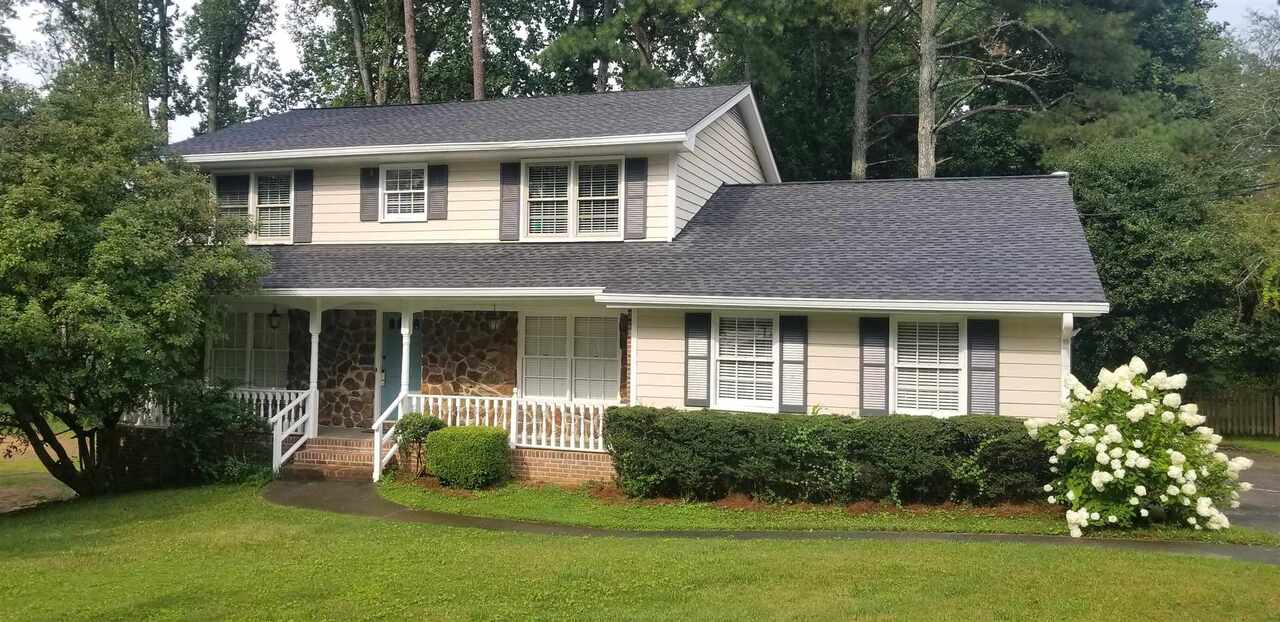 Great two story home in Dunwoody's Austin Elementary School district. Very short walk to Dunwoody Village and Dunwoody Nature Center. Formal living room and separate dining room. Separate den with fireplace. Kitchen has been updated with new cabinets, granite, and stainless steel appliances. Nicely updated baths. Large master with walk-in closet. Partially finished basement. Nice deck overlooking the backyard and patio at the basement level. Hardwood floors on main level and in master. Newer vinyl clad insulated windows.