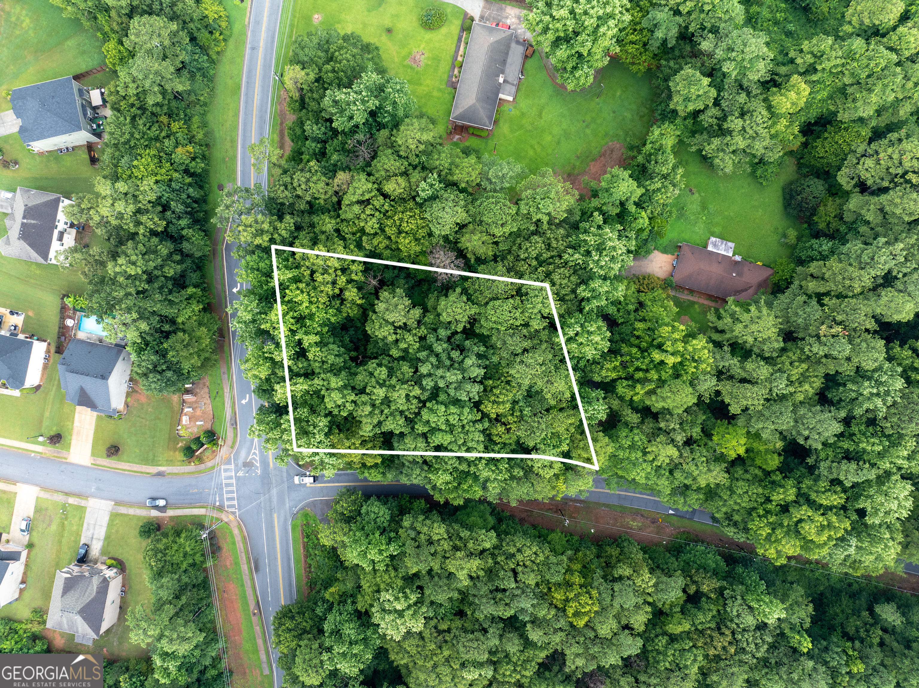 Rare Development Opportunity in Prime Ellenwood Location! Seize the chance to own nearly an acre of land in one of Metro Atlanta's most promising growth corridors! Situated at 4225 Weelaunee Rd, this prime parcel offers exceptional potential for future residential development or expansion of adjoining properties. Nestled in the heart of Ellenwood, the property boasts close proximity to key recreational and conservation highlights, including the Michelle Obama Trail, Intrenchment Creek Park, and the visionary South River Forest project-a future hub for greenspace and outdoor connectivity in Atlanta. With convenient access to I-675, I-285, and just minutes from Downtown Atlanta, this lot is ideally positioned for savvy investors or homeowners seeking long-term value in a transforming area. A recent survey is available, streamlining your path to planning and development. Don't miss this unique opportunity to invest in land that blends urban convenience with natural serenity-perfectly suited for the city's next chapter of residential expansion and environmental preservation.
