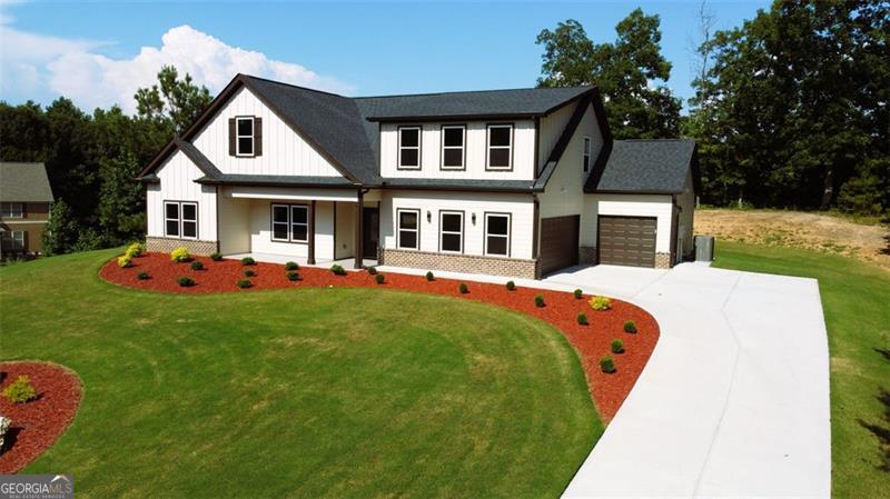 Welcome to 526 Whirlaway Street, Jefferson, GA - where custom craftsmanship, luxury finishes, and thoughtful design come together in a truly unique 3 bd 3.5 ba brand new home. Set in an established, friendly neighborhood just minutes from downtown Jefferson, this stunning residence is move-in ready and built to impress. Step through the front door and immediately feel the quality: soaring ceilings, elegant crown molding with ambient rope lighting, and an open-concept living space designed for comfort and style. This is not your run of the mill builders special. With a three-car garage - space for vehicles, hobbies, and storage, Energy-efficient hot water system with re-circulation pump for instant hot water, EV charging capabilities for eco-conscious living, the details were carefully thought and planned out. The heart of the home is the gourmet kitchen, featuring: Sleek quartz countertops, large single basin farm sink with disposal, 42" white shaker cabinetry, Stainless steel appliances, and over/under cabinet lighting for added sophistication. Relax by the floor-to-ceiling custom fireplace in the spacious living room or enjoy seamless entertaining with an open layout connecting to your dining space and kitchen. The main-level owners suite is a private sanctuary with: Cozy fireplace for ambiance, Spa-like en suite bathroom with freestanding soaking tub, Dual vanities with quartz countertops, Luxurious tile shower with a unique rainfall head. Expansive walk-in closet with custom shelving. Upstairs, you'll find a versatile bonus suite with its own full bathroom, wet bar, and oversized storage area - perfect as a home office, media room, or even a second master suite. . With ample natural light, high-end finishes, and a prime location, this home is a must-see! Contact us today to schedule a viewing.